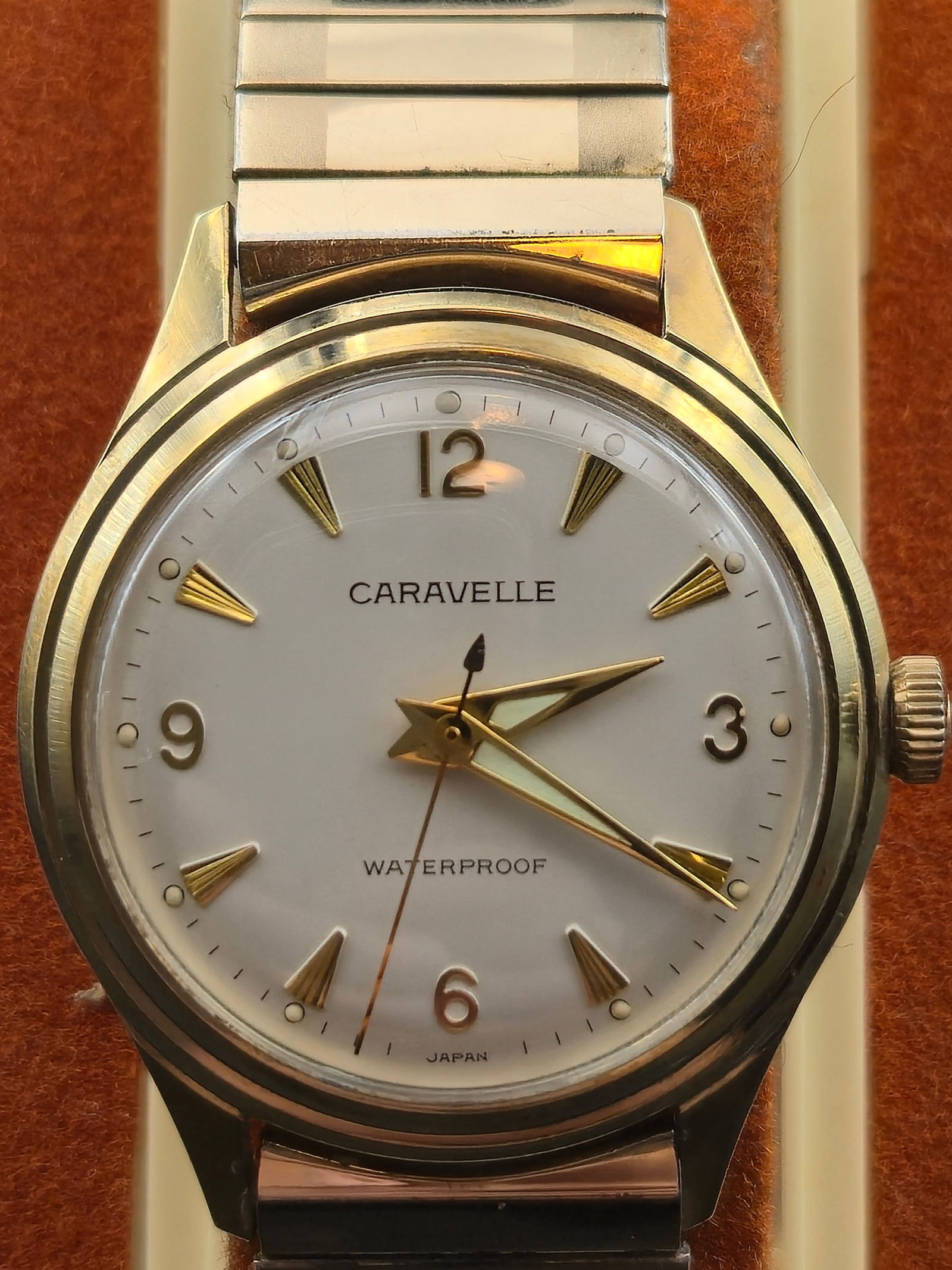 1966 Bulova Caravelle 7J Manual Watch Base Metal Case 32.2mm Original GF Band w/Box Runs: Vintage Bulova Caravelle wristwatch dated 1966 (M6), powered by a 7-jewel manual-wind movement. Clean silver dial with applied Arabic numerals and faceted gold-tone markers, original gold-tone hands w