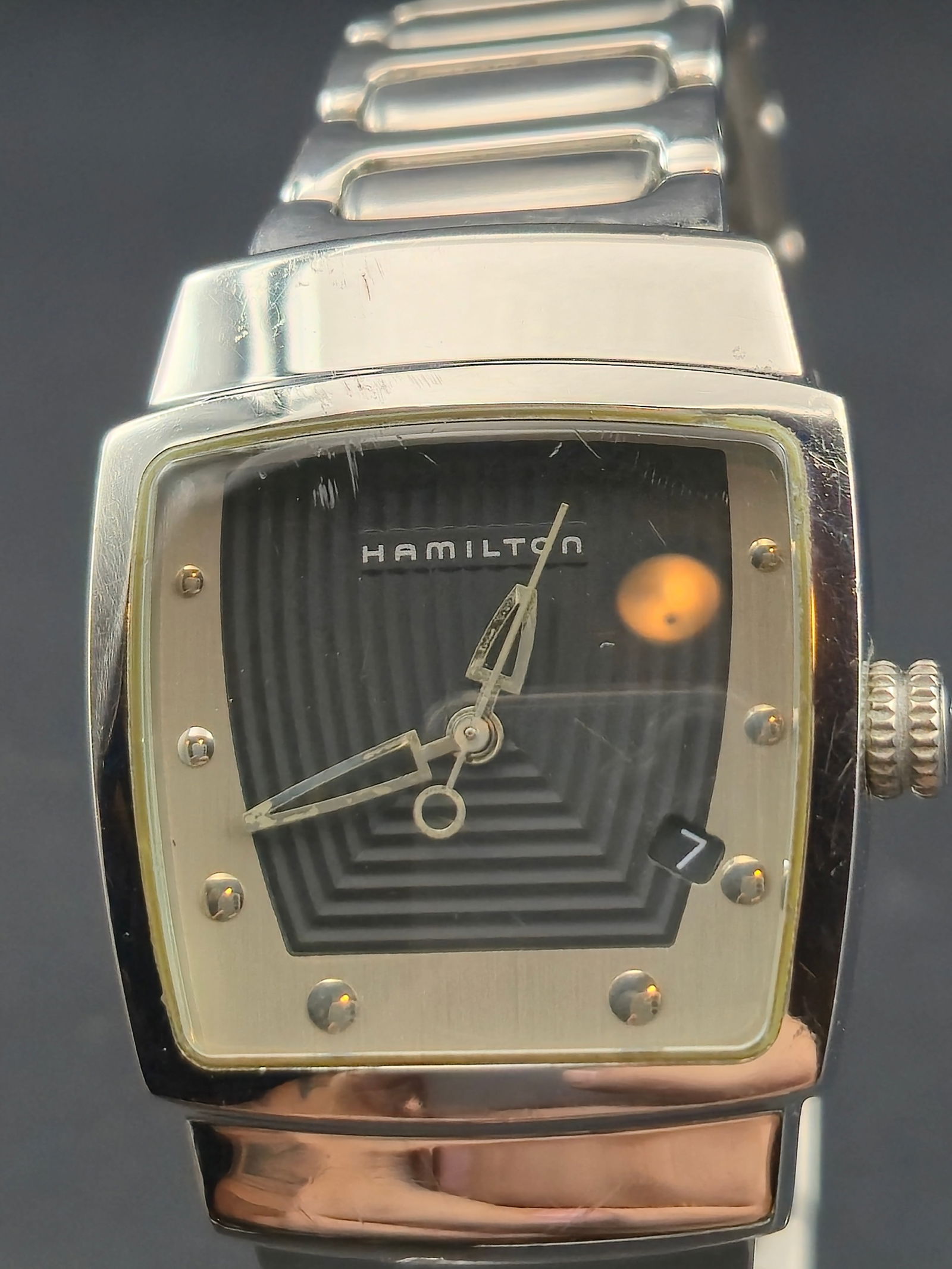 Hamilton Stainless Steel Square Quartz Wristwatch 30.9mm New Battery: Elegant Hamilton square stainless steel wristwatch featuring a sculpted polished case, stepped silver-tone bezel with applied hour markers, and a black geometric-pattern dial signed Hamilton. The watc