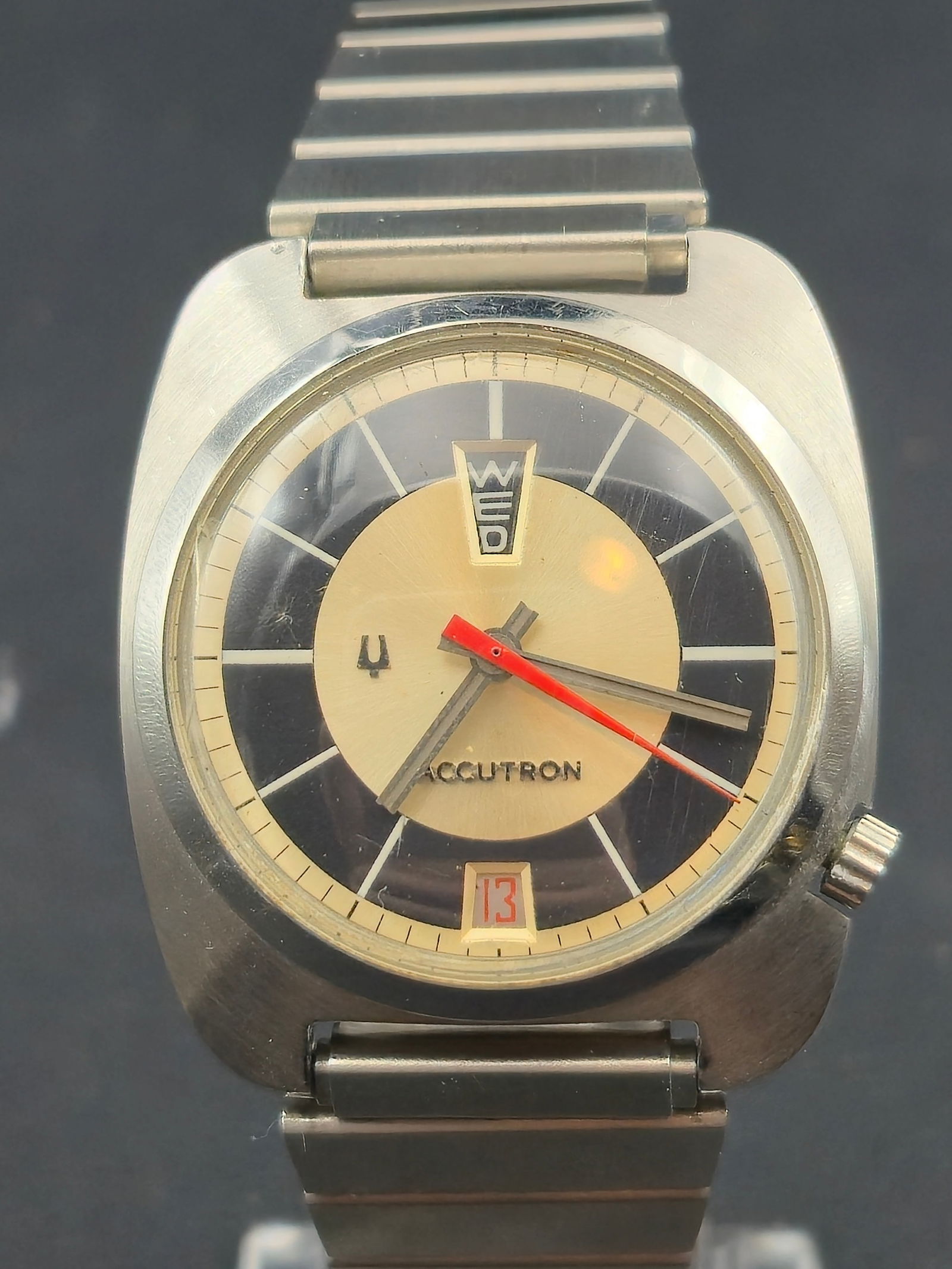 1970 Bulova Accutron 2182 Stainless Steel Case Black & Silver Bullseye Dial Speidel Bracelet 34.92mm: Bulova Accutron wristwatch featuring a black and silver bullseye (sector-style) dial with concentric two-tone design. Dial reads ACCUTRON with applied hour markers, tuning fork logo, red sweep seconds