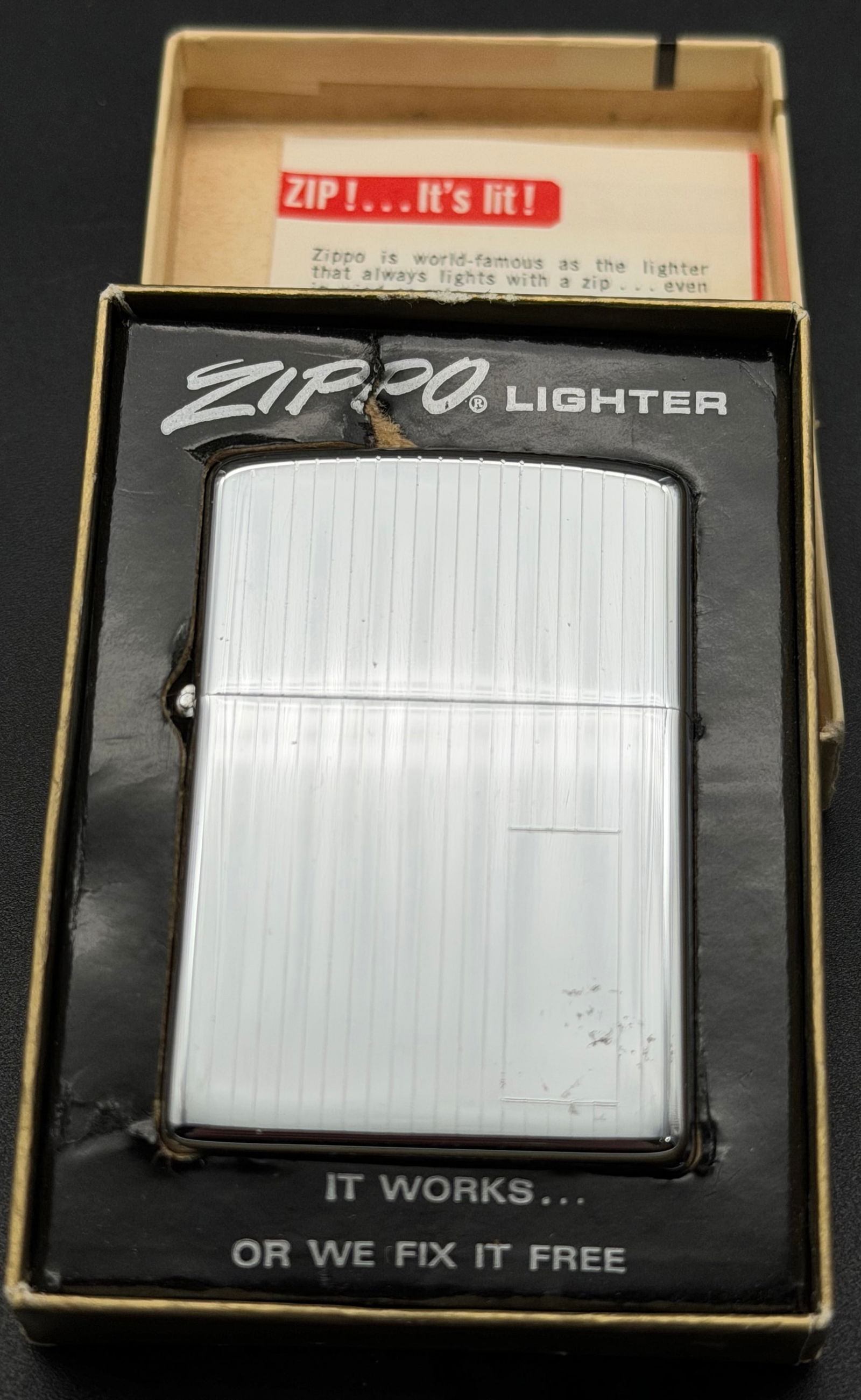 Vintage Zippo Lighter Vertical Line Chrome Finish – Original Box – Made in USA: Vintage Zippo windproof lighter with classic vertical line chrome finish.Marked “Zippo Mfg. Co. Bradford, PA – Made in U.S.A.” on the bottom.Includes the original Zippo presentation box .