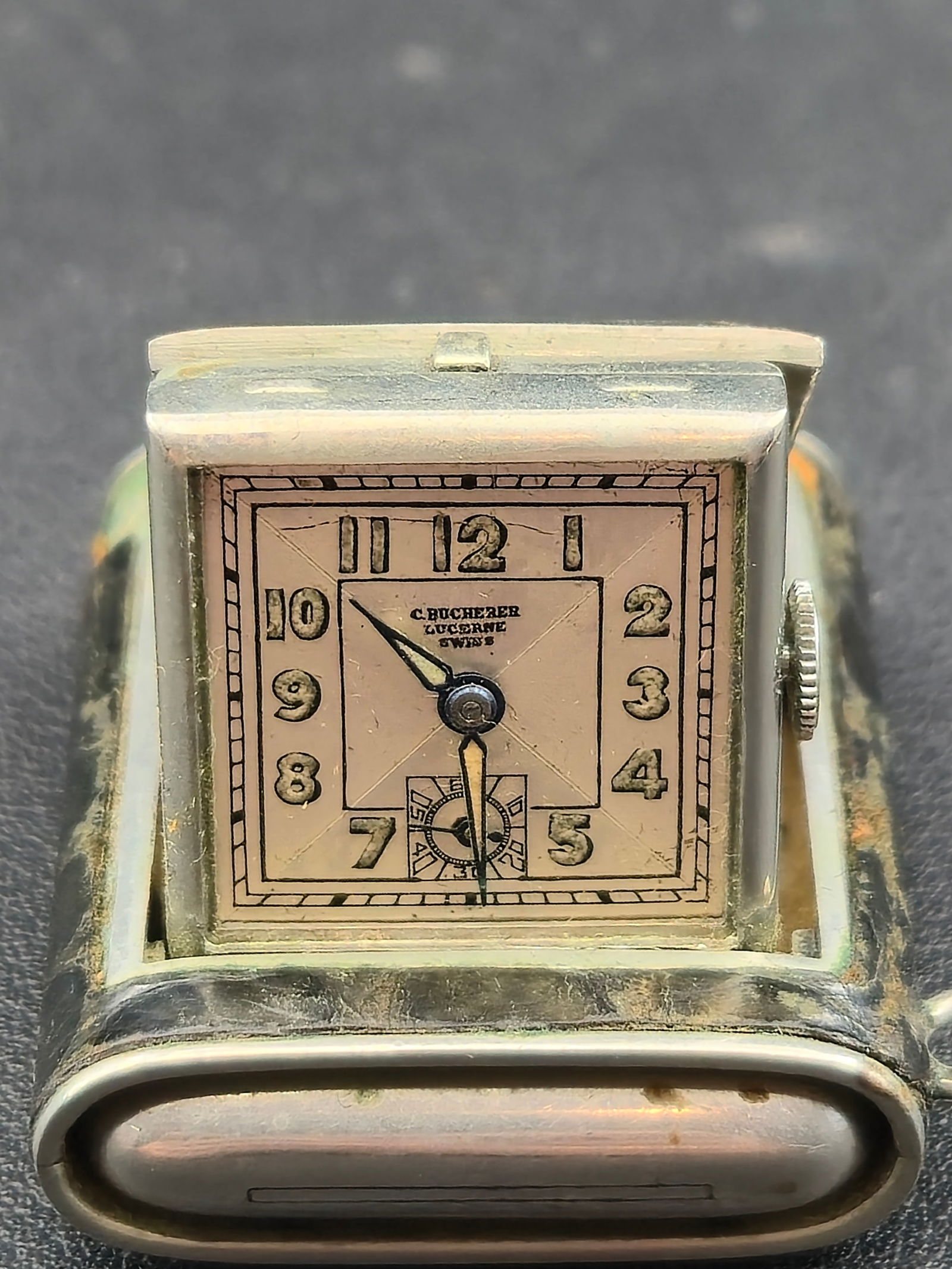 Vintage C. Bucherer Lucerne Swiss Folding Travel Clock 15J Crocodile Case Runs Needs Crystal: Vintage Swiss folding travel clock signed C. Bucherer – Lucerne. Rectangular hinged case opens to a standing position and closes flat for travel. Clock is housed in a metal case wrapped in textured
