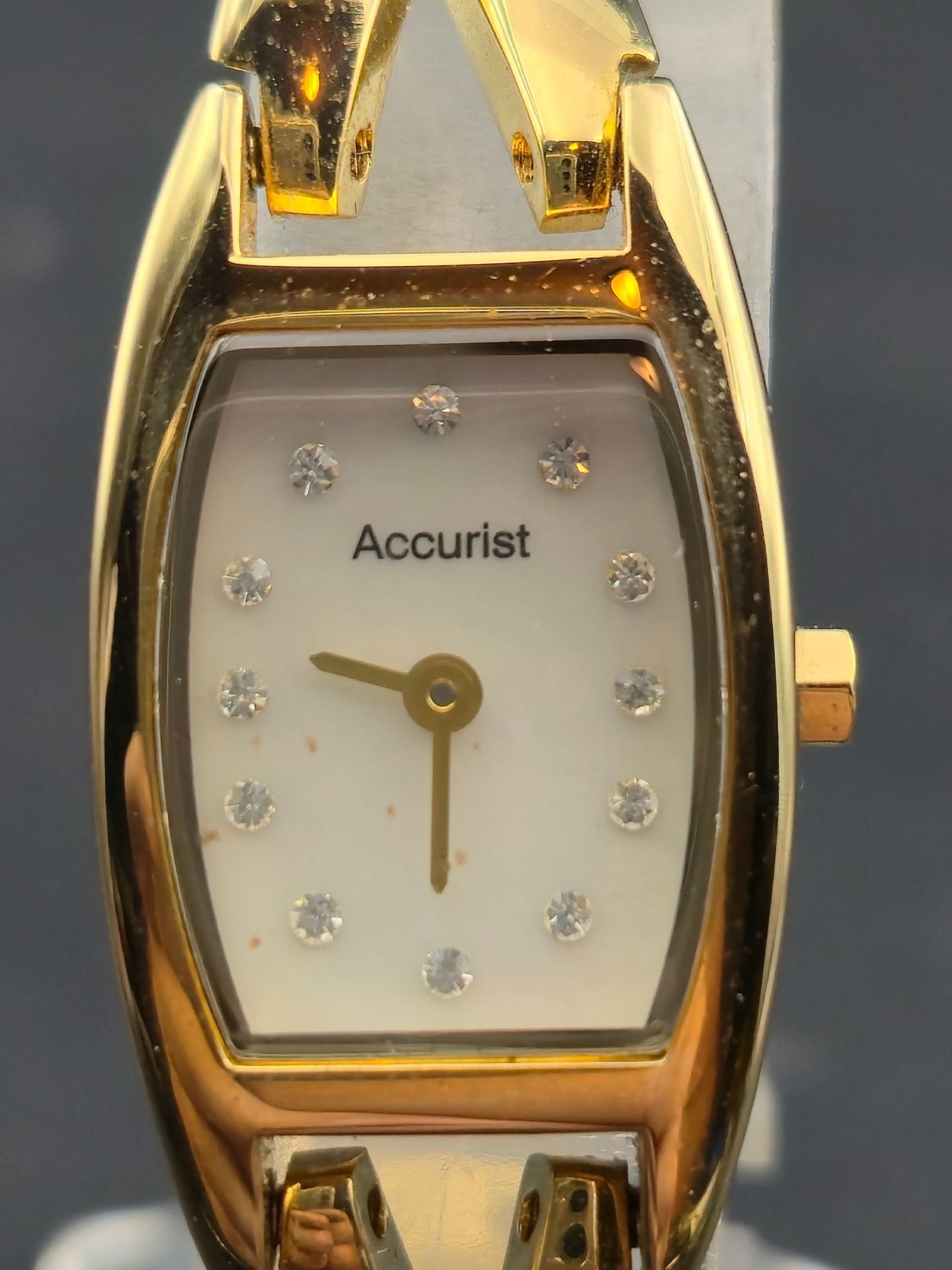 Accurist Ladies Gold-Tone Quartz 18mm Crystal Dial With Box & Papers: Accurist ladies quartz wristwatch featuring a gold-tone case and integrated bracelet with a white dial set with crystal hour markers. Dial is signed Accurist with gold-tone hands. Caseback is stamped
