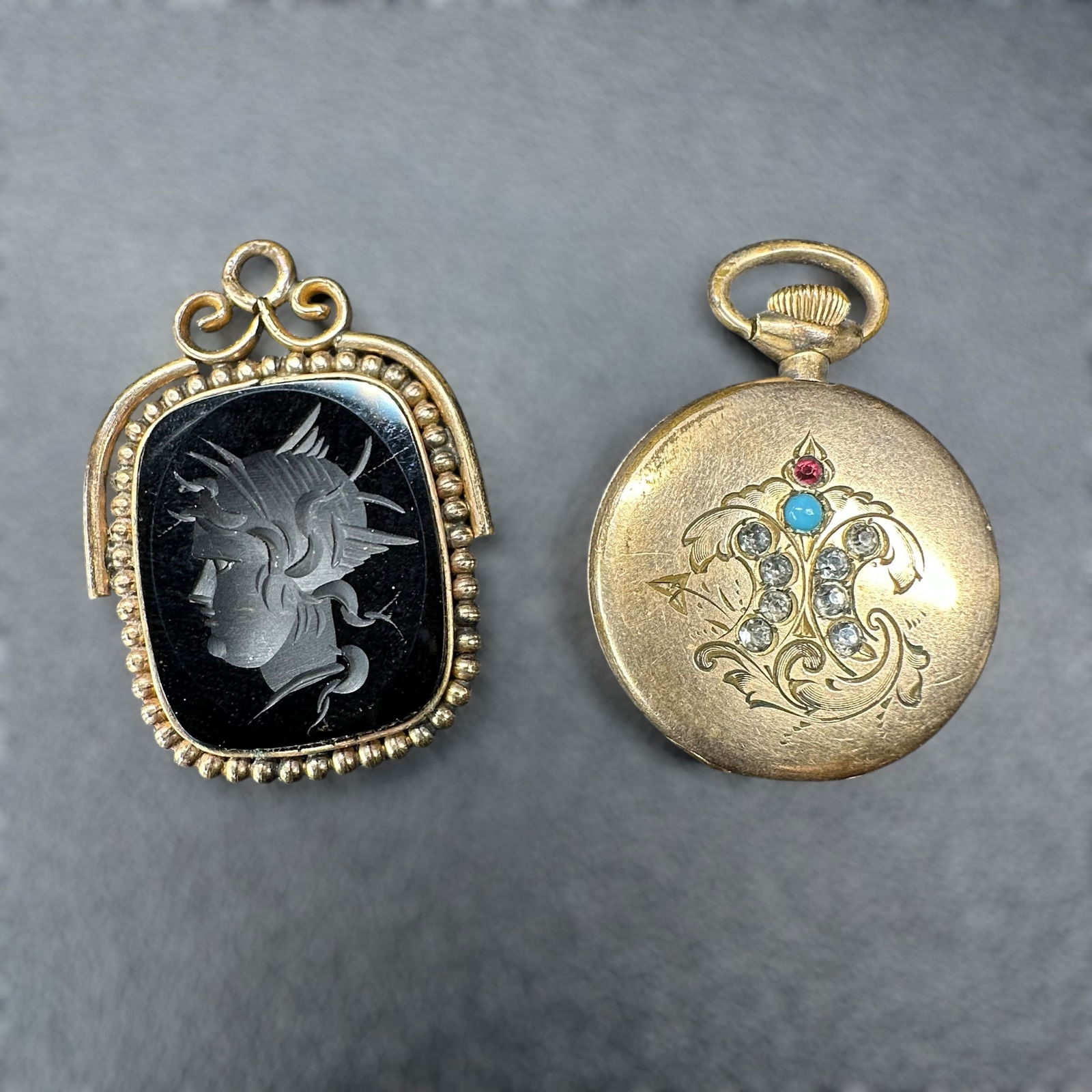 15g Gold Tone Victorian Greek Intaglio Pendant & Locket Pendant Lot - 2 Pc: 15g Gold tone Victorian Greek Intaglio & Pendant & Locket Pendant Lot: 2 Pc:Brand/Model: Unknown.Manufacturer Location: Unknown.Year Produced: Unknown; Condition: Overall good condition with surface w