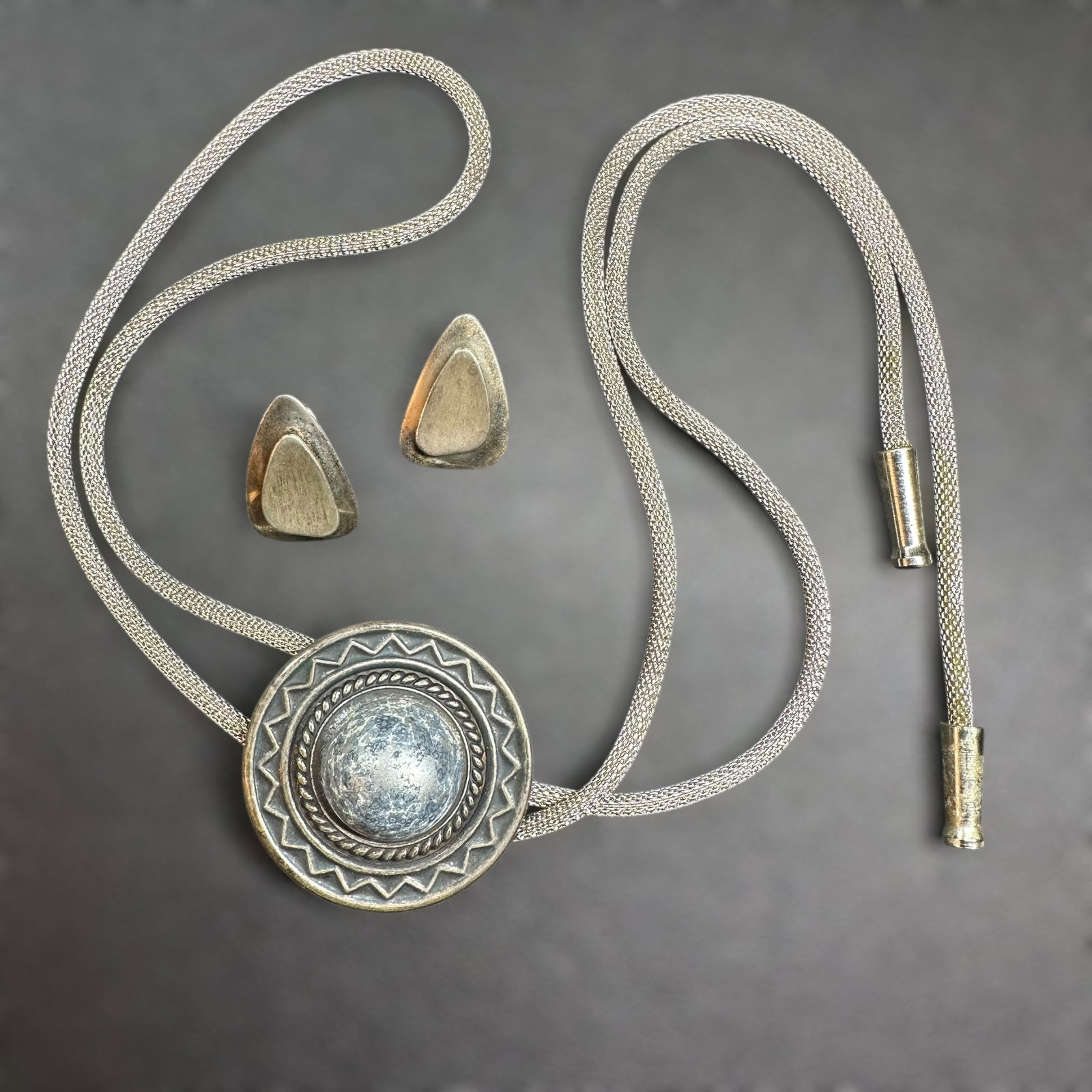 34"/50g Vintage Silver Tone Bolo Tie & Sterling Silver Earrings: 36"/50g Vintage Silver Tone Bolo Tie & Sterling Silver Earrings Lot:Brand/Model: Unknown. No hallmarks. Manufacturer Location: Unknown.Year Produced: Unknown; Condition: Overall good pre-owned conditi