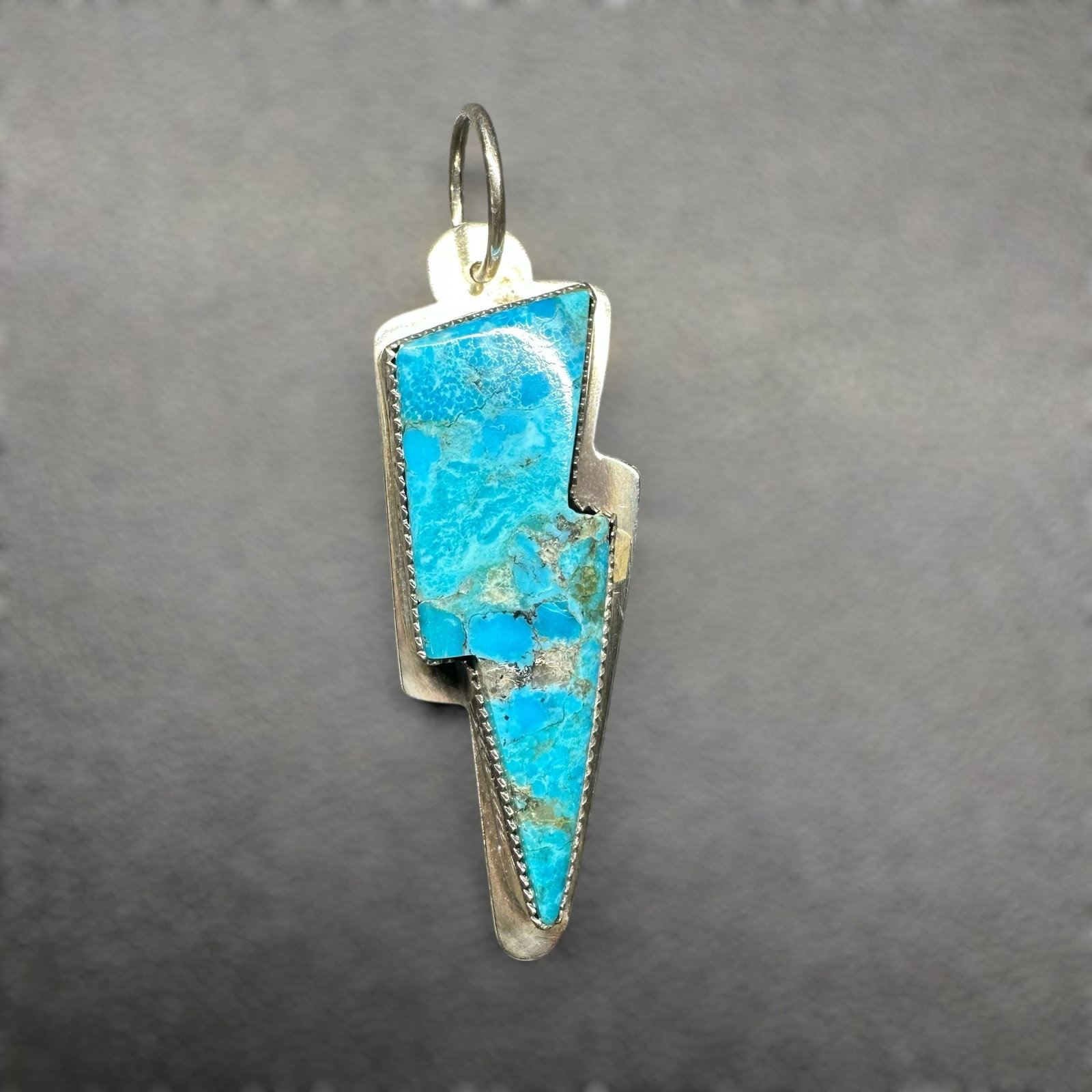 11g Native American Sterling Silver Turquoise "I Am the Storm" Lightning Bolt Pendant: 11g Native American Sterling Silver Turquoise "I Am the Storm" Lightning Bolt PendantBrand/Model: Unknown artisan, no hallmark.Manufacturer Location: Unknonwn.Year Produced: Unknown.Condition: Overall