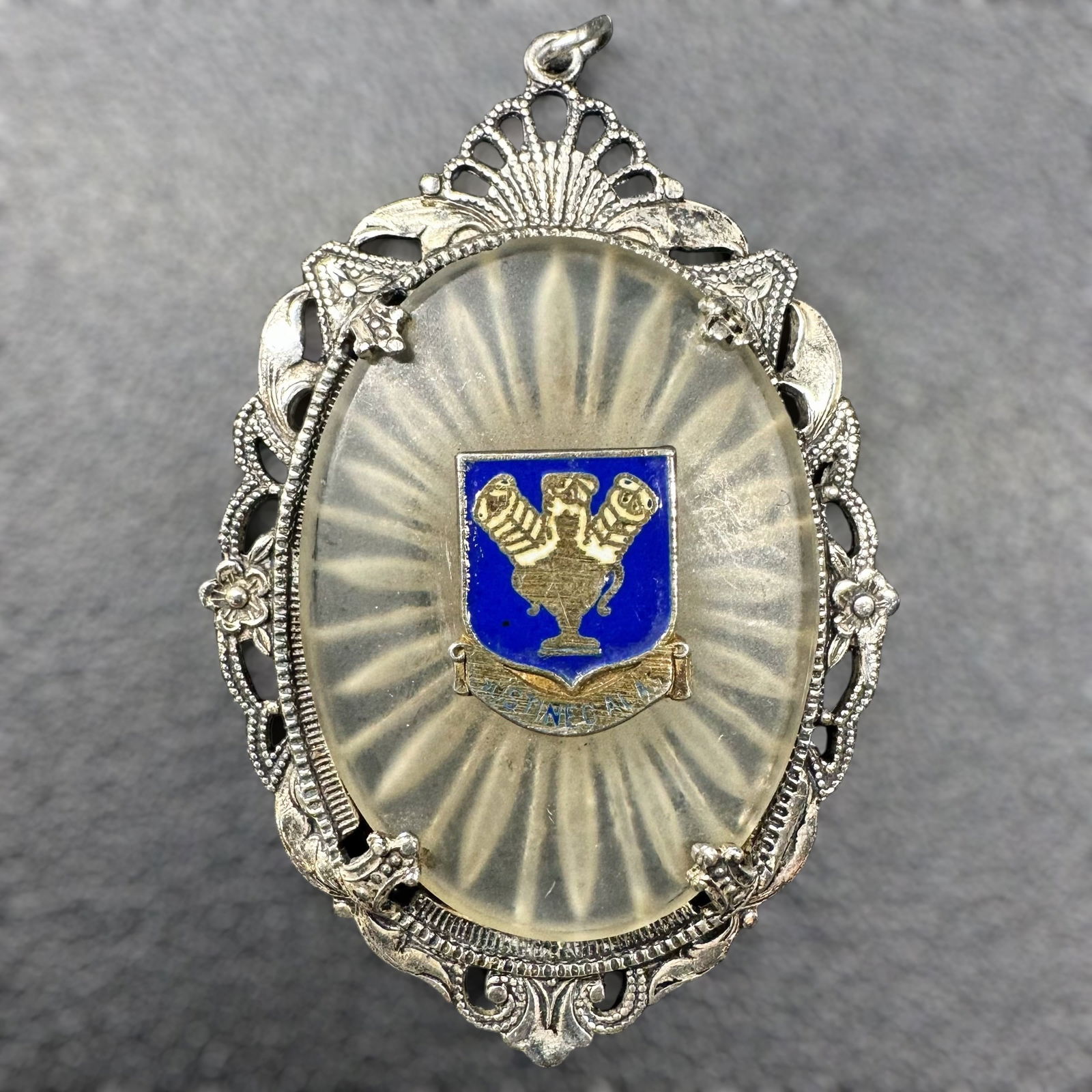 7g Sterling Silver Enamel Crest Pendant: 7g Sterling Silver Enamel Crest Pendant:Brand/Model: Unknown.Manufacturer Location: Not marked.Year Produced: Unknown.Condition: Excellent condition with minimal wear. The enamel is intact with no vis