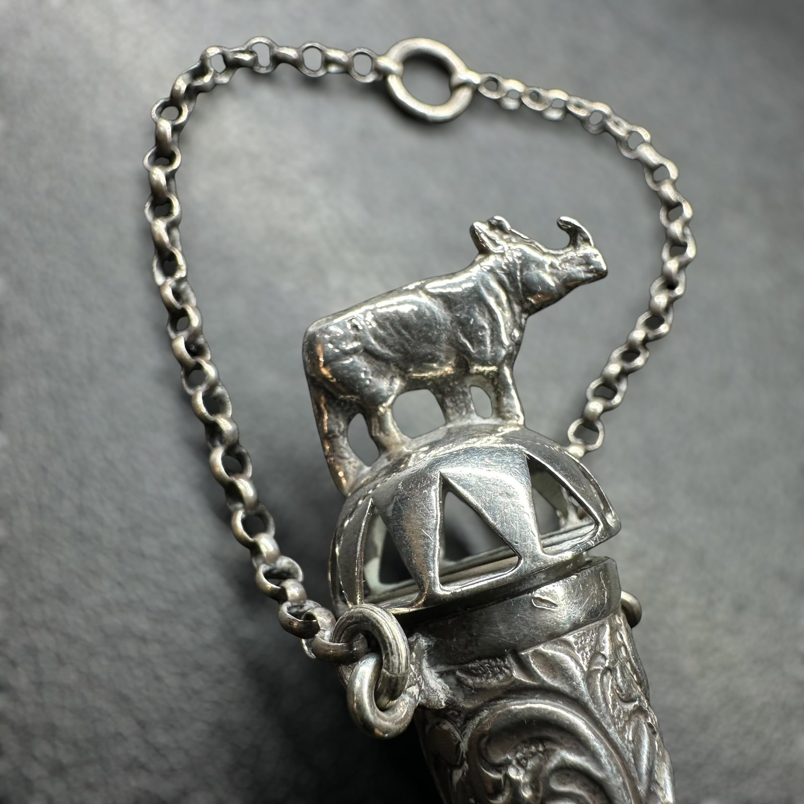 18g Sterling Silver Container Pendant w/ Ornate Rhino Motif: Ornate Sterling Silver Decanter Pendant w/ Rhino Motif:Brand/Model: Unknown.Manufacturer Location: Not marked.Year Produced: Unknown.Condition: Overall good vintage condition with surface wear, light 