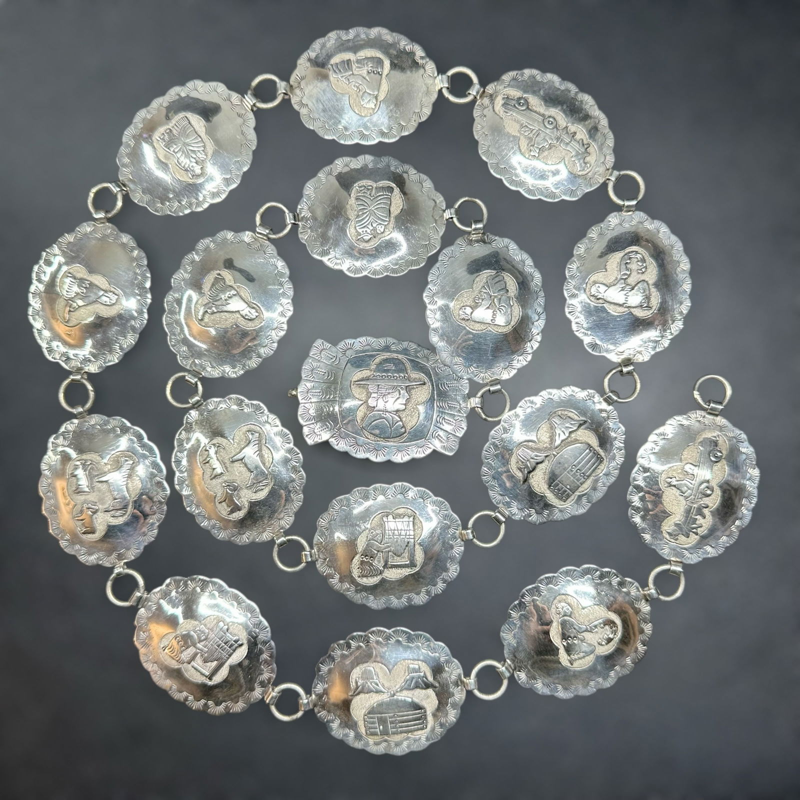 39.5"/181g Native American Navajo Russ Rockbridge Sterling Silver Storyteller Concho Belt: 39.5"/181g Native American Navajo Russ Rockbridge Sterling Silver Storyteller Concho Belt:Brand/Model: Hallmarked “RR”; Richard L. Reeve Apache. Native American concho belt.Manufacturer Locati