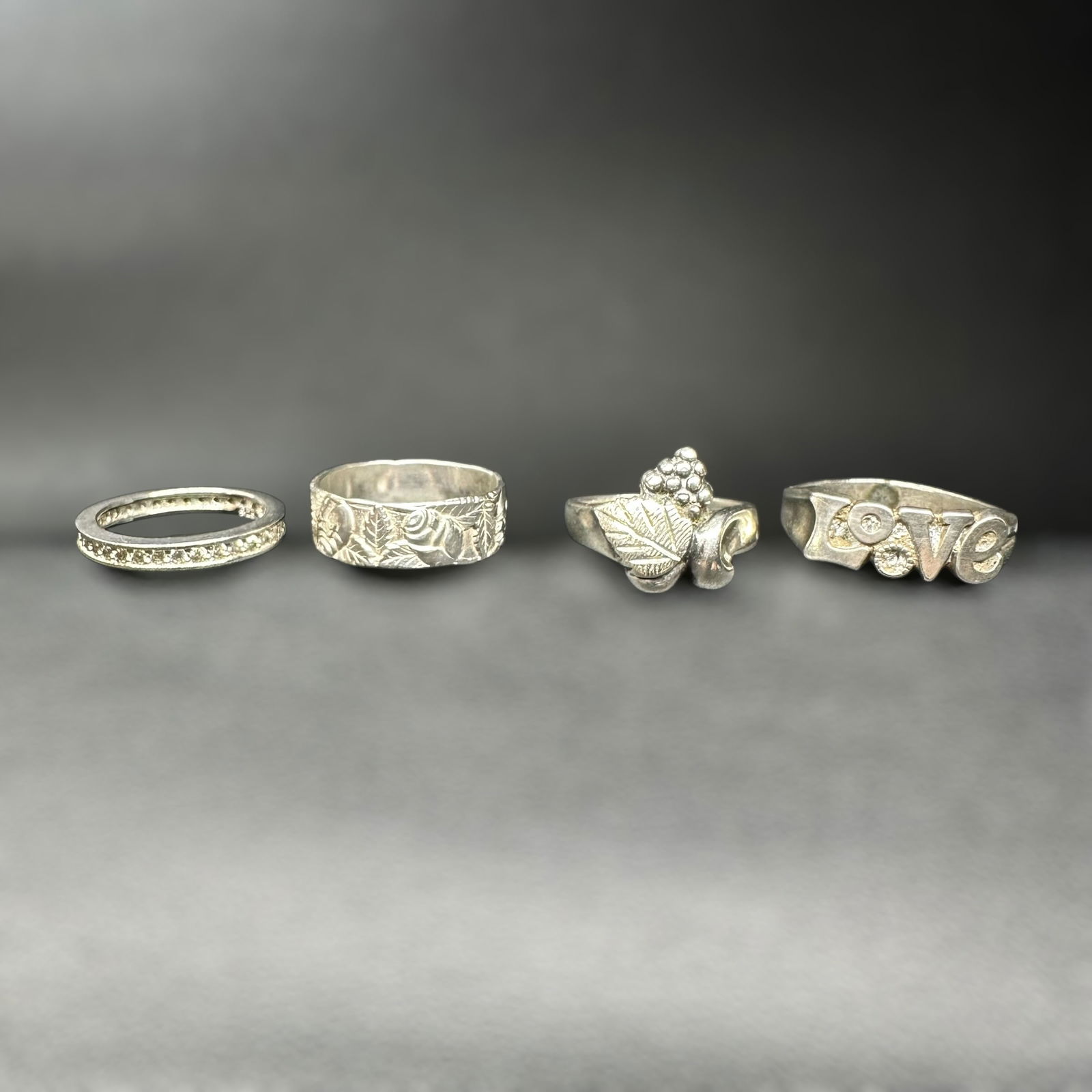 Sz4/Sz5/Sz5.75/Sz8/11g Sterling Silver Faceted Clear Stone, Ornate Bands & "Love" Motif Ring Lot (1 of 16)