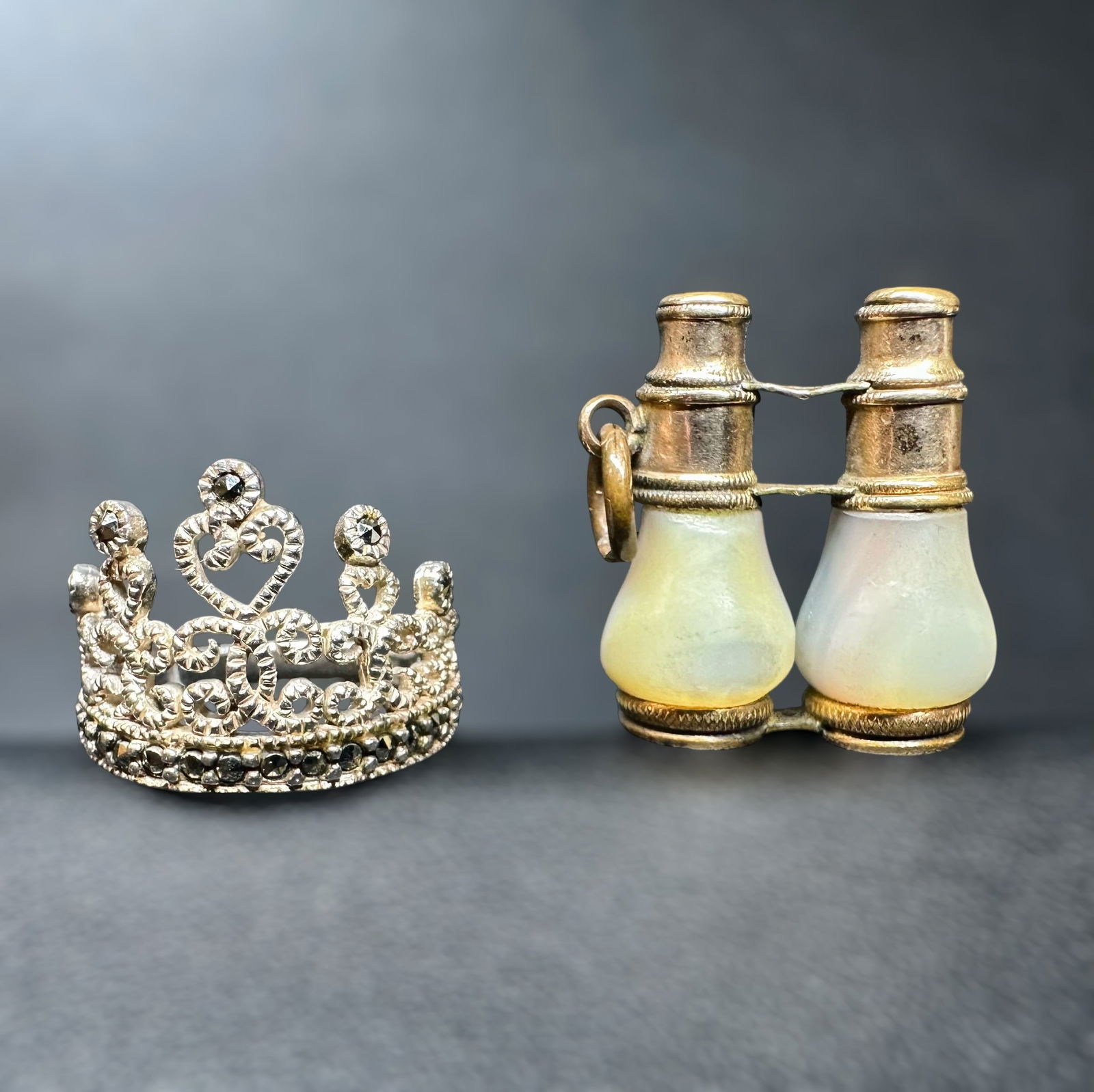 Sz5.5/9g Sterling Silver Marcasite Crown Ring & Mother of Pearl Brass Opera Glasses Lot: Sz5.5/9g Sterling Silver Crown Ring & Mother of Pearl Brass Opera Glasses LotBrand/Model: Unknown brand; mixed styles.Manufacturer Location: Not marked.Year Produced: Unknown; likely mid to late 20th