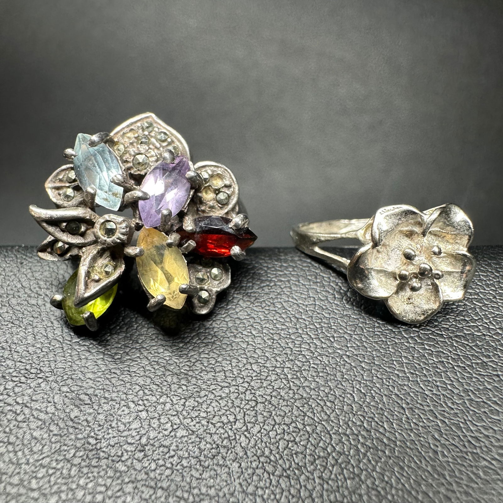 Sz6.25//Sz6.5/9g 925 Sterling Silver Marcasite Faceted Multi-Stone Floral Ring Lot: Sz6.25//Sz6.5/9g 925 Sterling Silver Marcasite Faceted Multi-Stone Floral Ring Lot:Brand/Model: Unknown brand; mixed styles.Manufacturer Location: Not marked.Year Produced: Unknown.Condition: Overall