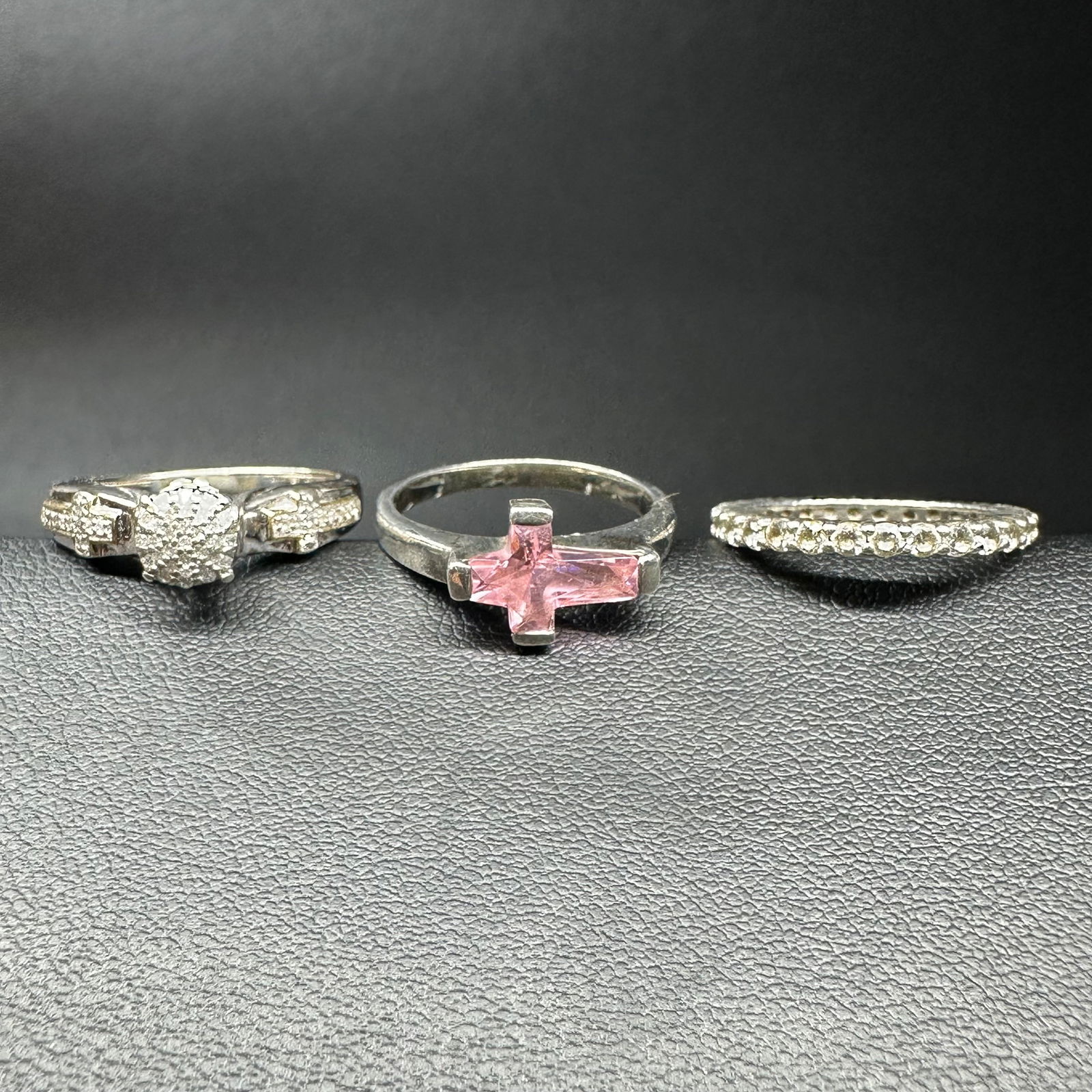 Sz.4.75/SzSz7/Sz6.75/8g Sterling Silver Cubic Zirconia & Faceted Pink Stone Cross Ring Lot: Sz.4.75/SzSz7/Sz6.75/8g Sterling Silver Cubic Zirconia & Faceted Pink Stone Cross Ring Lot:Description:Brand/Model: Unmarked; mixed styles.Manufacturer Location: Not marked.Year Produced: Unknown.Cond