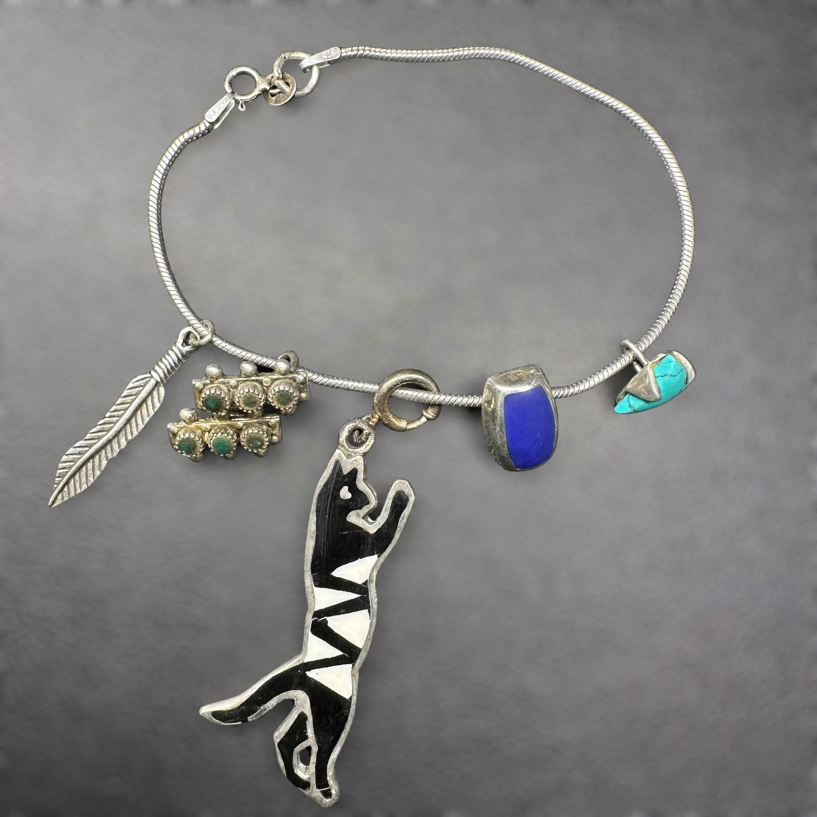 7.25”/12g Native American & Mexican 925 Sterling Silver Turquoise Lapis Charm Bracelet: 7.25”/12g Native American & Mexican 925 Sterling Silver Turquoise Lapis Charm Bracelet:Brand/Model: Unknown; mixed charms. Native American Zuni petit point charm. Lapis charm marked; "925 Mexico