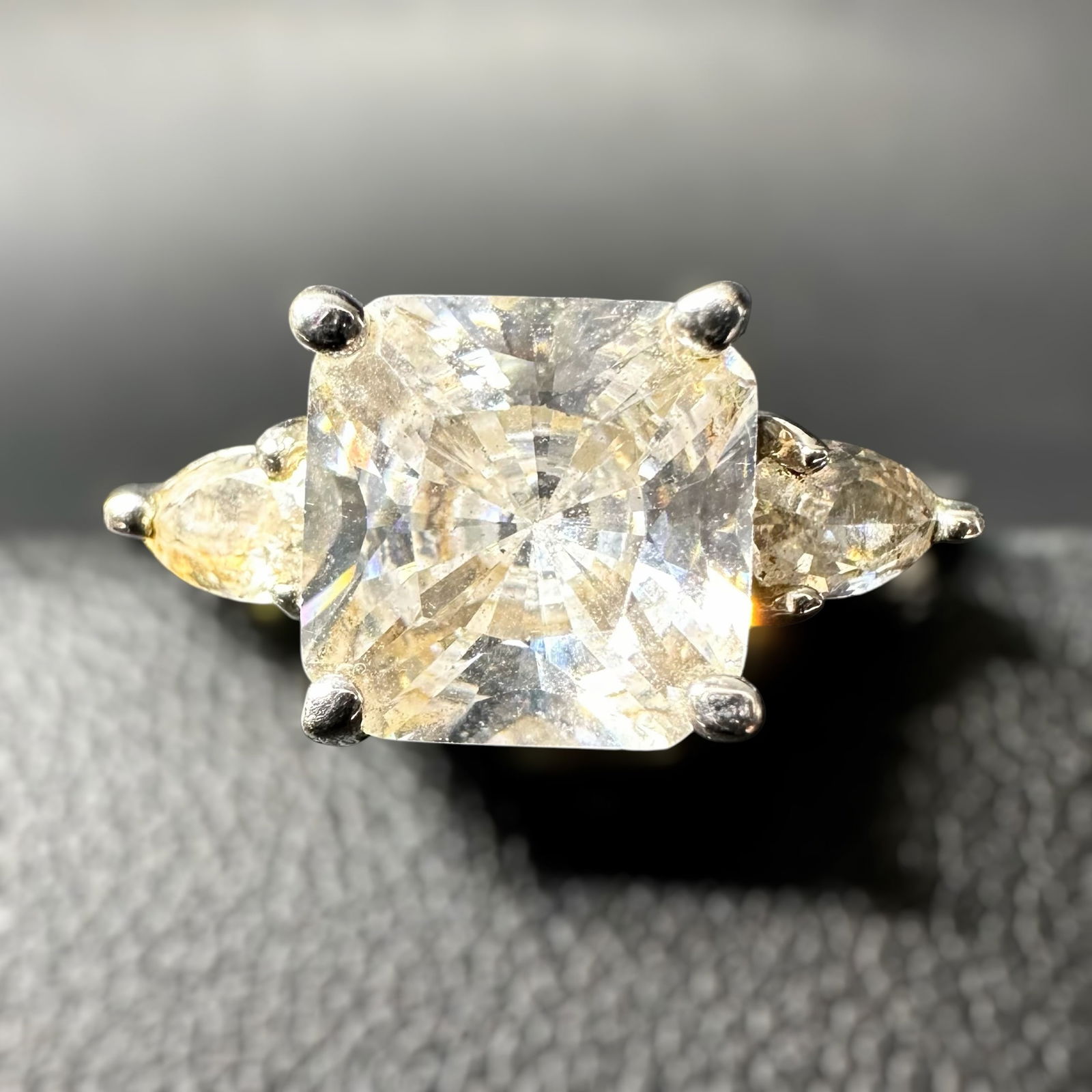 Sz7.5/3gSz7.5/3g 925 Sterling Silver Cubic Zirconia Ring: Sz7.5/3g 925 Sterling Silver Cubic Zirconia Ring:Brand/Model: Unknown; three stone style ring.Manufacturer Location: Not marked.Year Produced: Unknown.Condition: Good overall condition with light surf