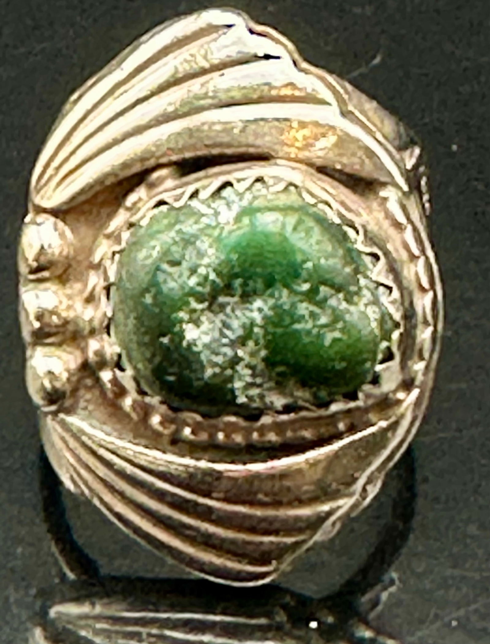Vintage Sterling Silver Green Stone Ring – HM – 21g: Vintage sterling silver ring featuring an oval green cabochon stone in a heavy, hand-worked setting. The ring has bold ribbed shoulders, scalloped bezel, and applied bead details, giving it a strong S