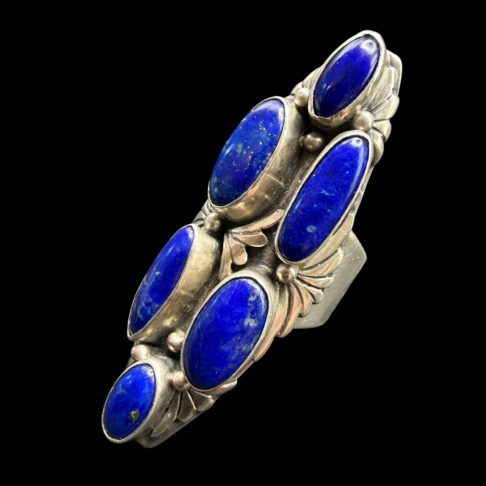 Sterling Silver Blue Lapis Native American Sharon Sandoval Ring Sz 10 Flexible 20.07g 925: Maker: Sharon Sandoval, Navajo. / Material: Sterling Silver. / Stone: Blue Lapis. / Size: 10, flexible. Face measures 2 1/8” long. / Weight: 20.07 grams. / Condition: Excellent and ready to be e