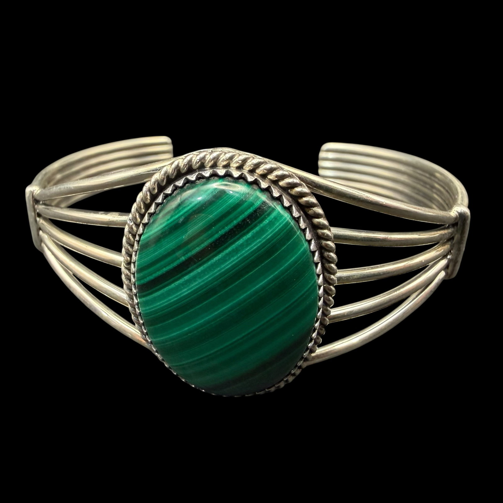 Native American Sterling Silver Green Malachite Cuff Bracelet Old Pawn 24.18g 925: Maker: Unmarked, possibly Old Pawn. / Material: Sterling Silver. / Stone: Green Malachite. / Size: 2 5/8” x 1 3/4”. Minimal flex. Face measures 1 1/8” wide. / Weight: 24.18 grams. /