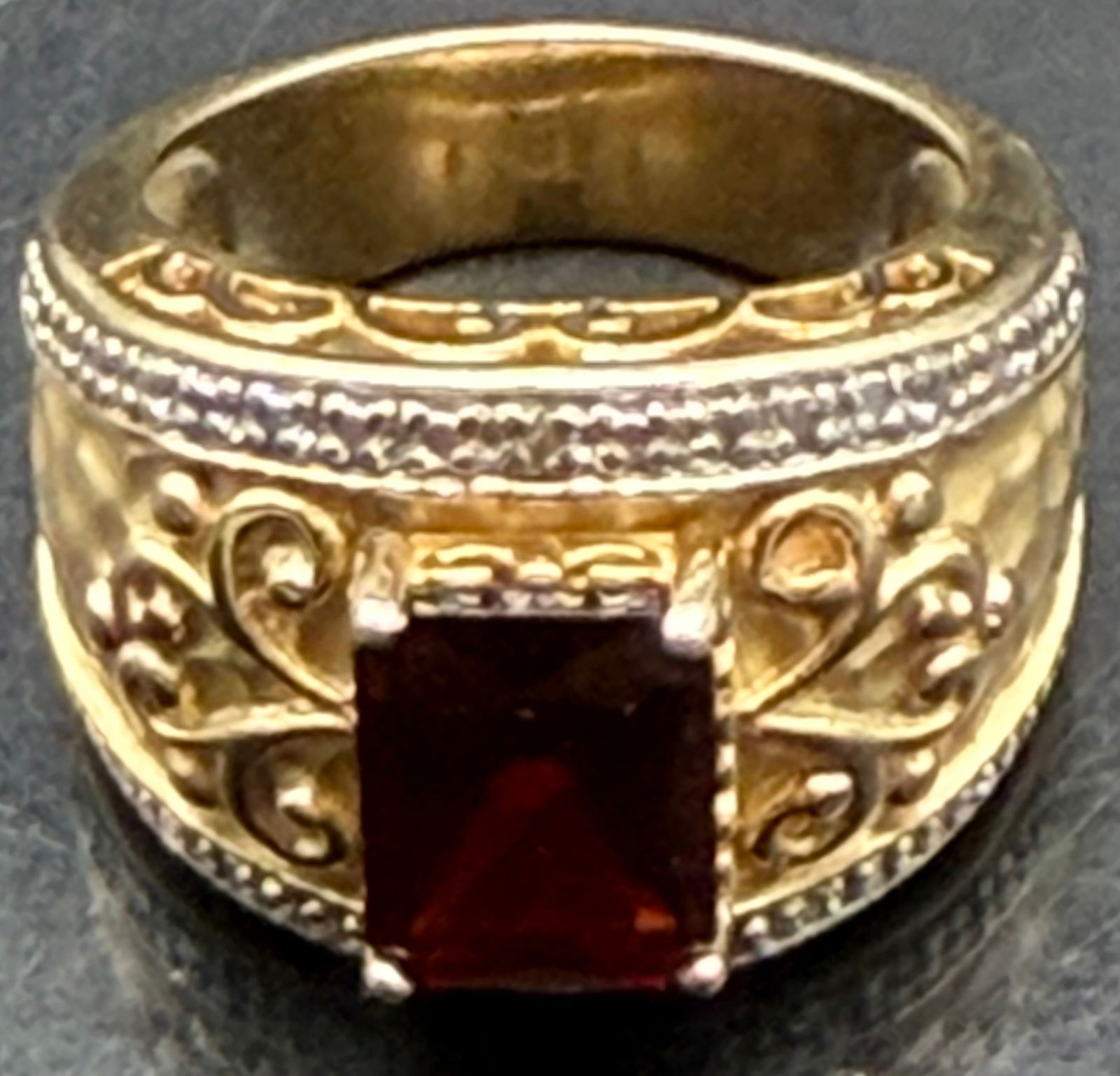 Vintage 925 Sterling Silver Red Stone Ring-8g: Nice vintage sterling silver ring set with a rectangular deep red stone. Band has decorative scrollwork and is clearly marked 925 inside.