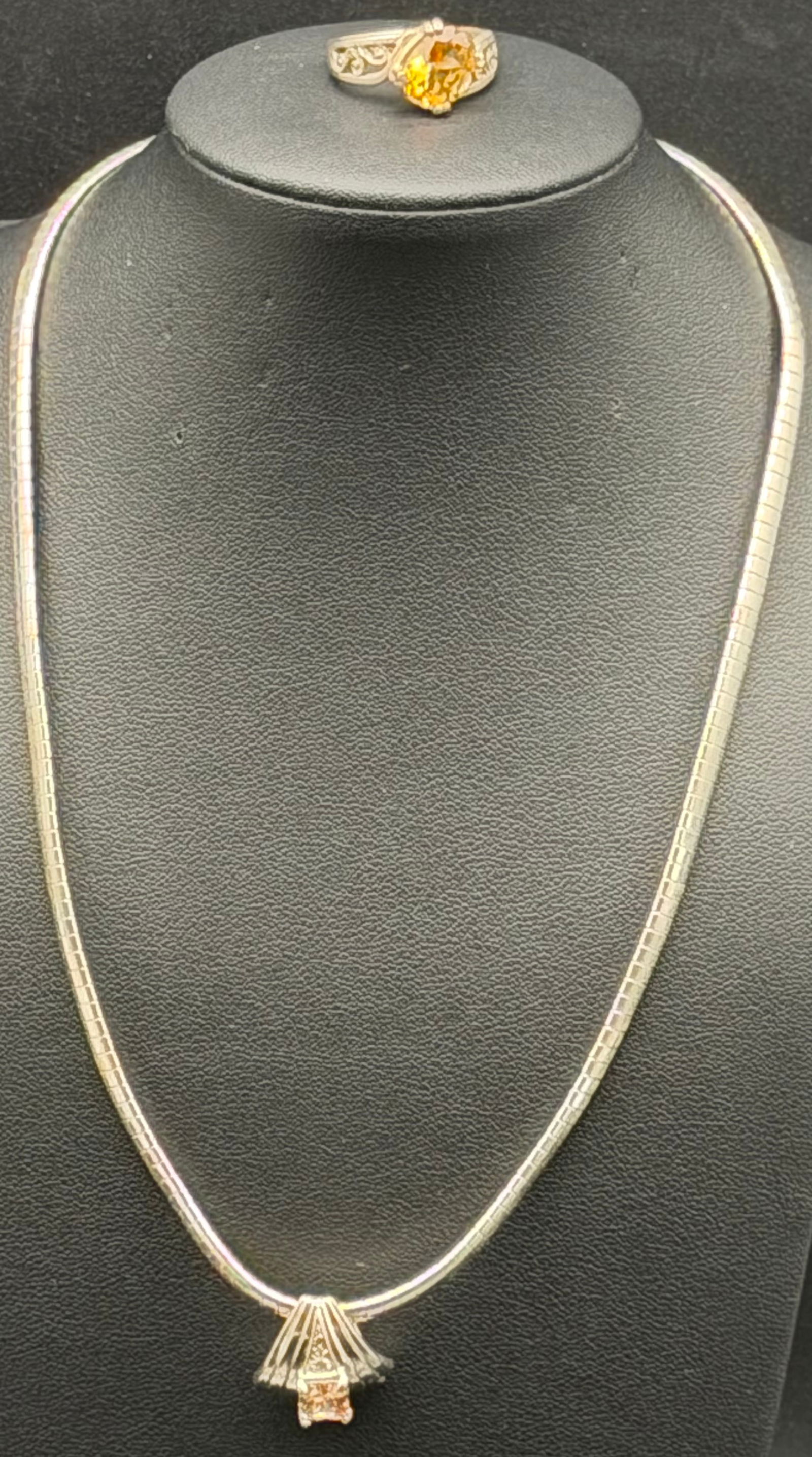 Beautiful Sterling Silver 925 Necklace & Citrine Color Ring Set – 24g: Vintage sterling silver (marked 925) necklace and matching ring set. Necklace features a sleek square-link/snake-style chain with a decorative drop pendant accented by a warm amber/citrine-color stone