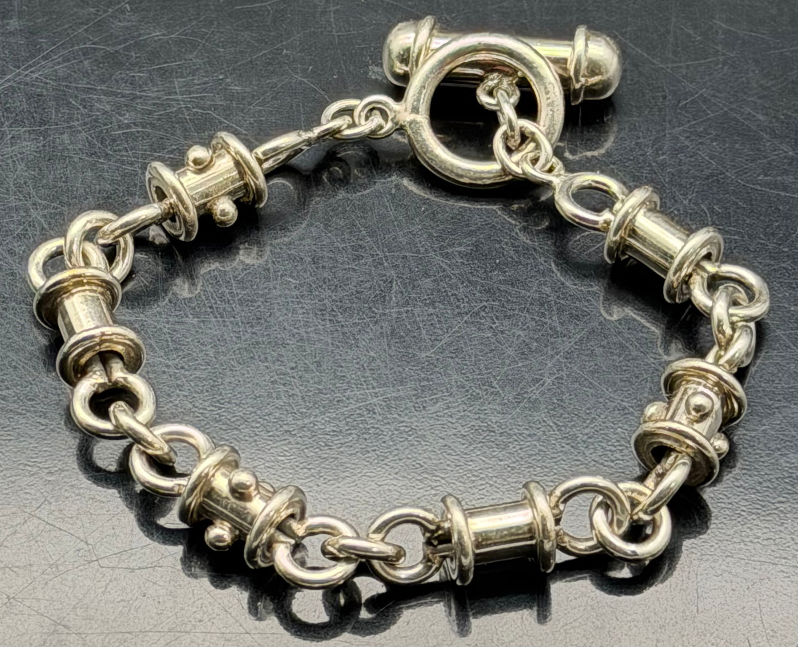 Heavy 925 Sterling Silver Toggle Barrel Link Bracelet 44g: Solid sterling silver bracelet featuring chunky barrel/spool style links and a secure toggle clasp. Marked 925 for sterling silver. Bold modernist look with substantial weight and smooth polished fini