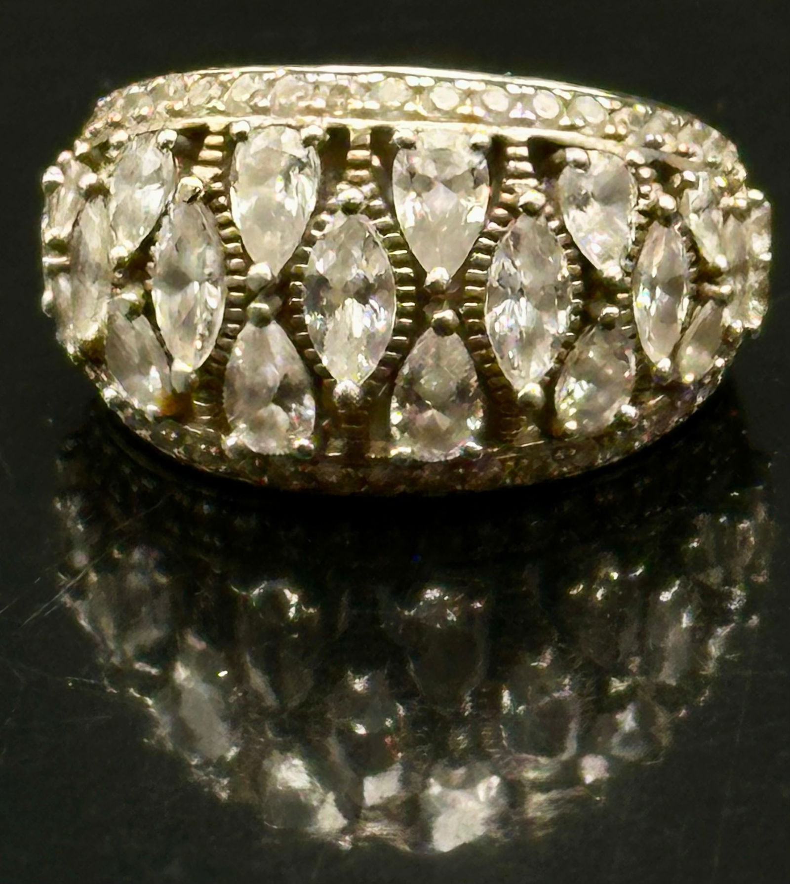 Sterling Silver White Stone Cluster Ring 9g: Sterling silver statement ring featuring sparkling marquise-cut white stones arranged in an elegant crown-style cluster design. The ring is marked X 925 STS and weighs approximately 9 grams. A bold es