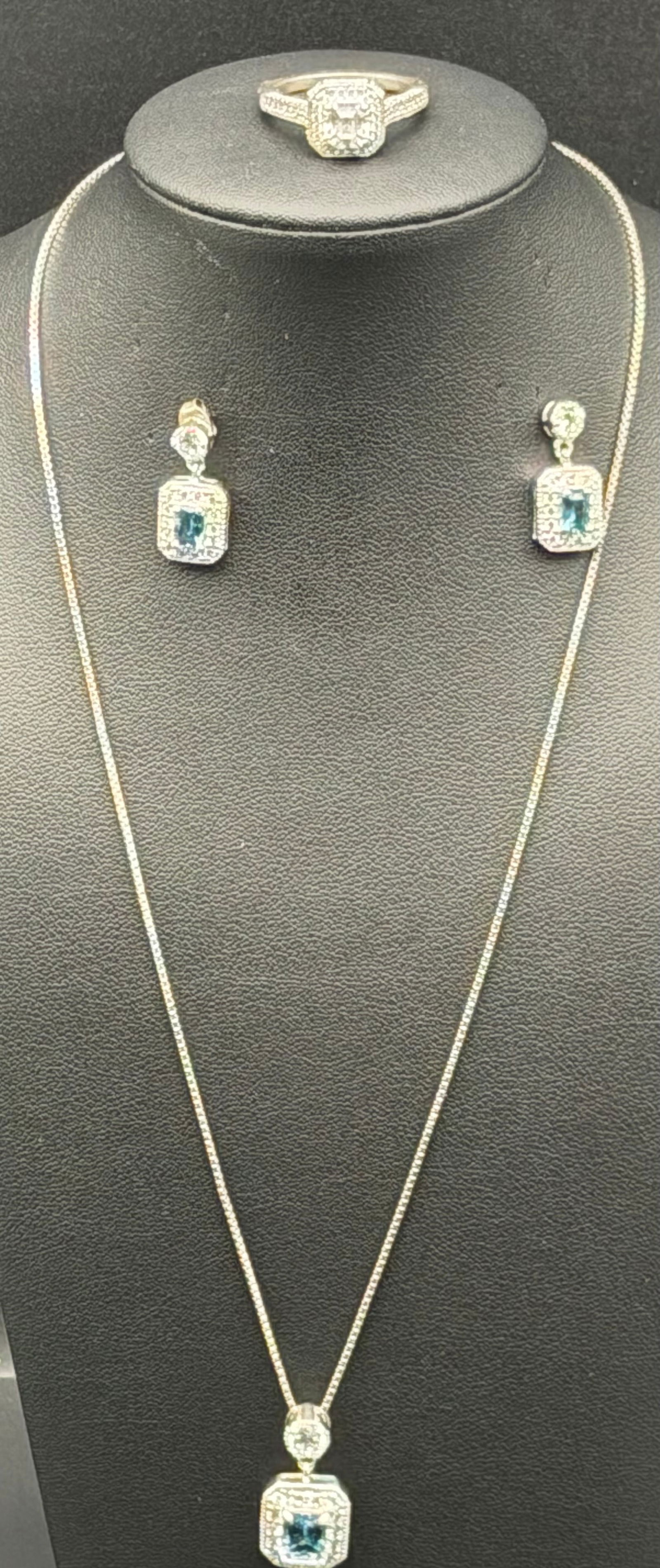 Sterling Silver 925 Blue Stone Jewelry Set – Necklace, Ring & Earrings – 14g: Elegant matching jewelry set crafted in stamped 925 sterling silver, including necklace with pendant, ring, and pair of earrings. Each piece features a rectangular blue center stone surrounded by clea