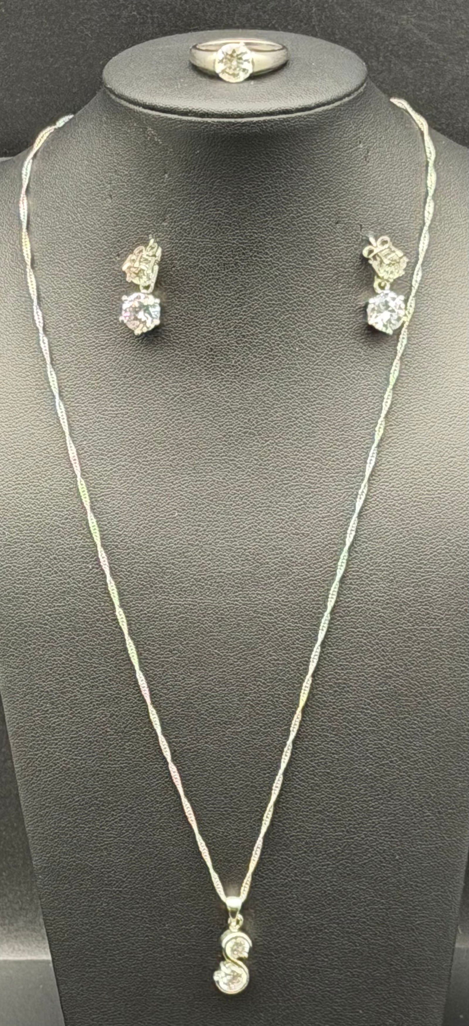 Vintage Sterling Silver CZ Jewelry Set – Necklace, Ring & Earrings – 13g Total: Elegant vintage sterling silver jewelry set including a pendant necklace, matching ring, and stud/drop earrings. Each piece is set with clear sparkling stones (likely cubic zirconia) in a classic brig