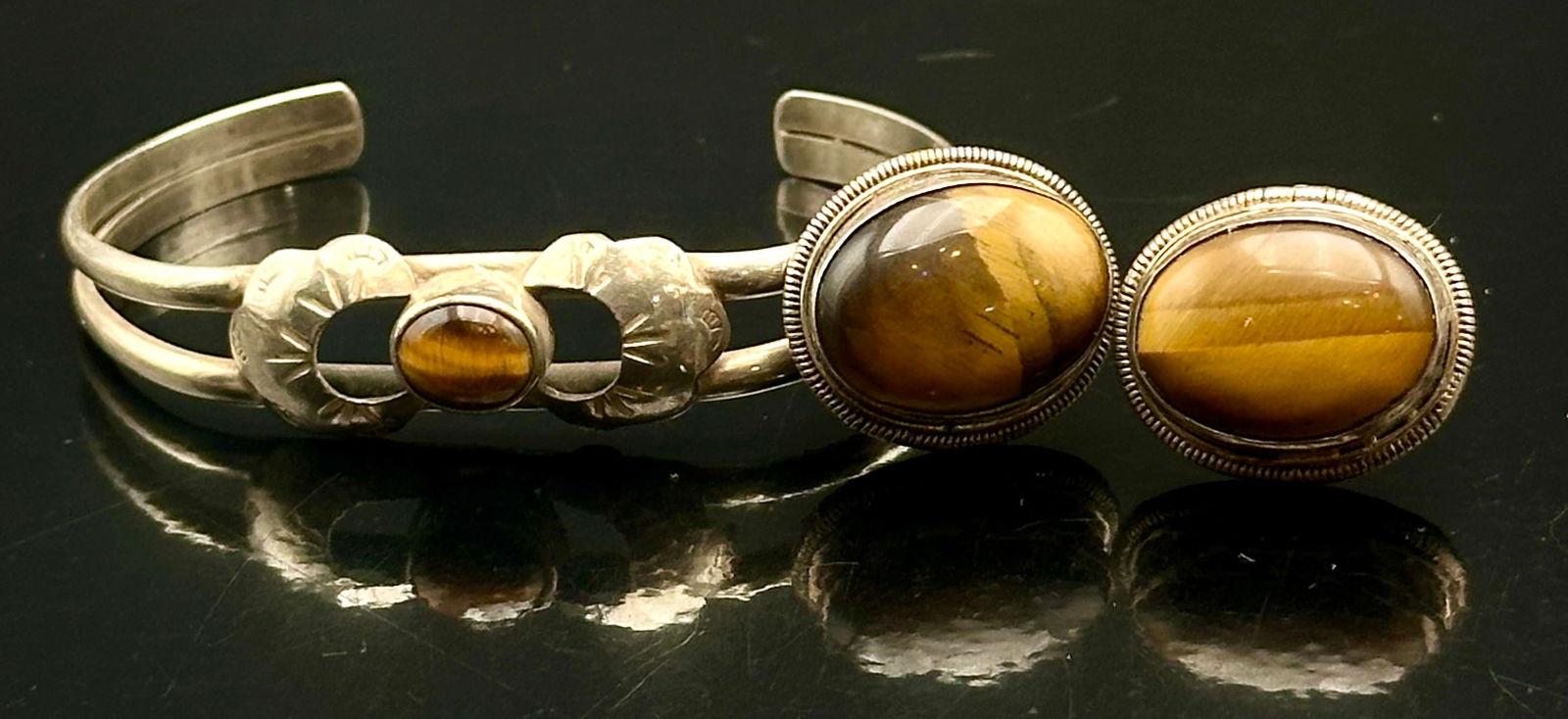 Sterling Silver Tiger’s Eye Cuff Bracelet & Earrings Set, 27g: Vintage sterling silver jewelry set featuring warm golden-brown tiger’s eye cabochon stones. The set includes a handcrafted open cuff bracelet accented with floral-style silver details and a center