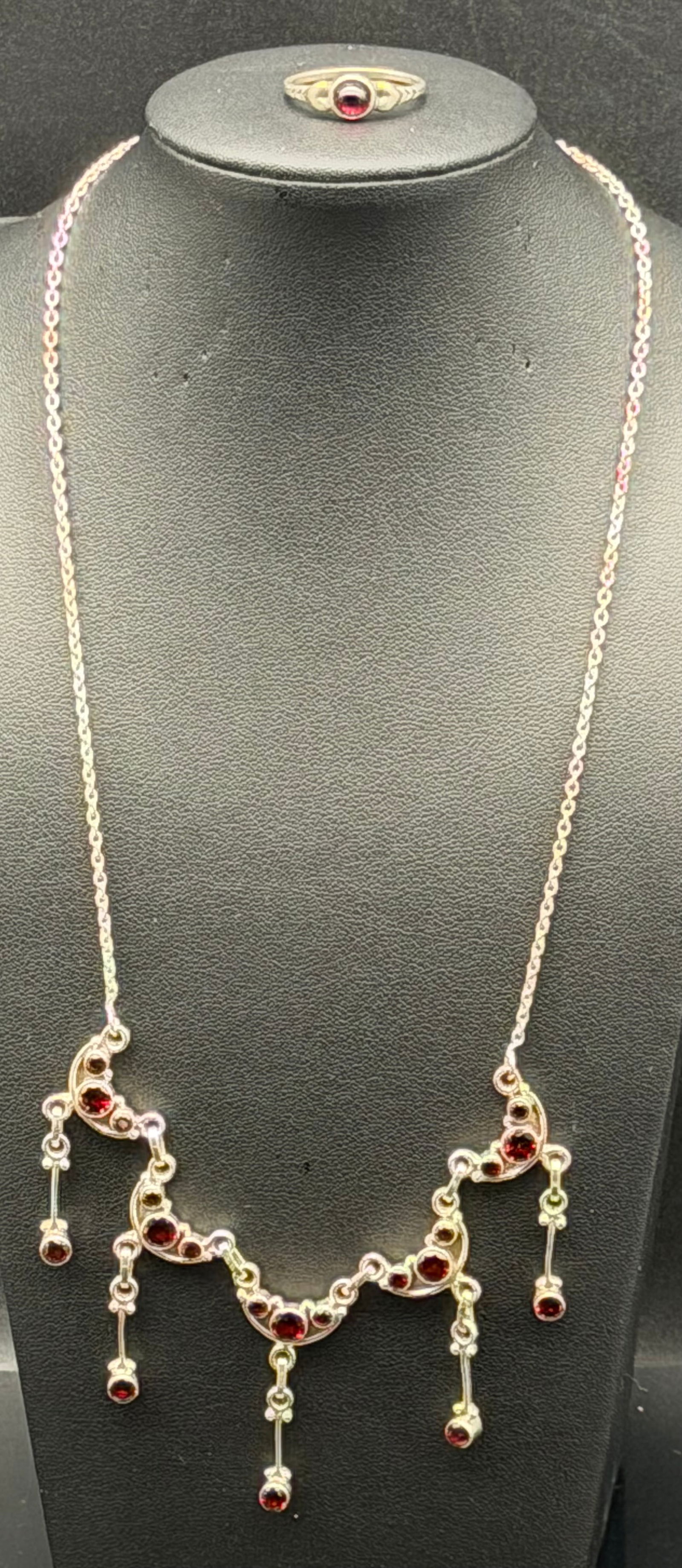 Beautiful 925 Sterling Silver Garnet Drop Necklace & Ring Set 22g: Beautiful sterling silver necklace and ring set featuring deep red stones in a classic drop/fringe design. Necklace has multiple dangling red stone accents across a curved center section on a fine sil