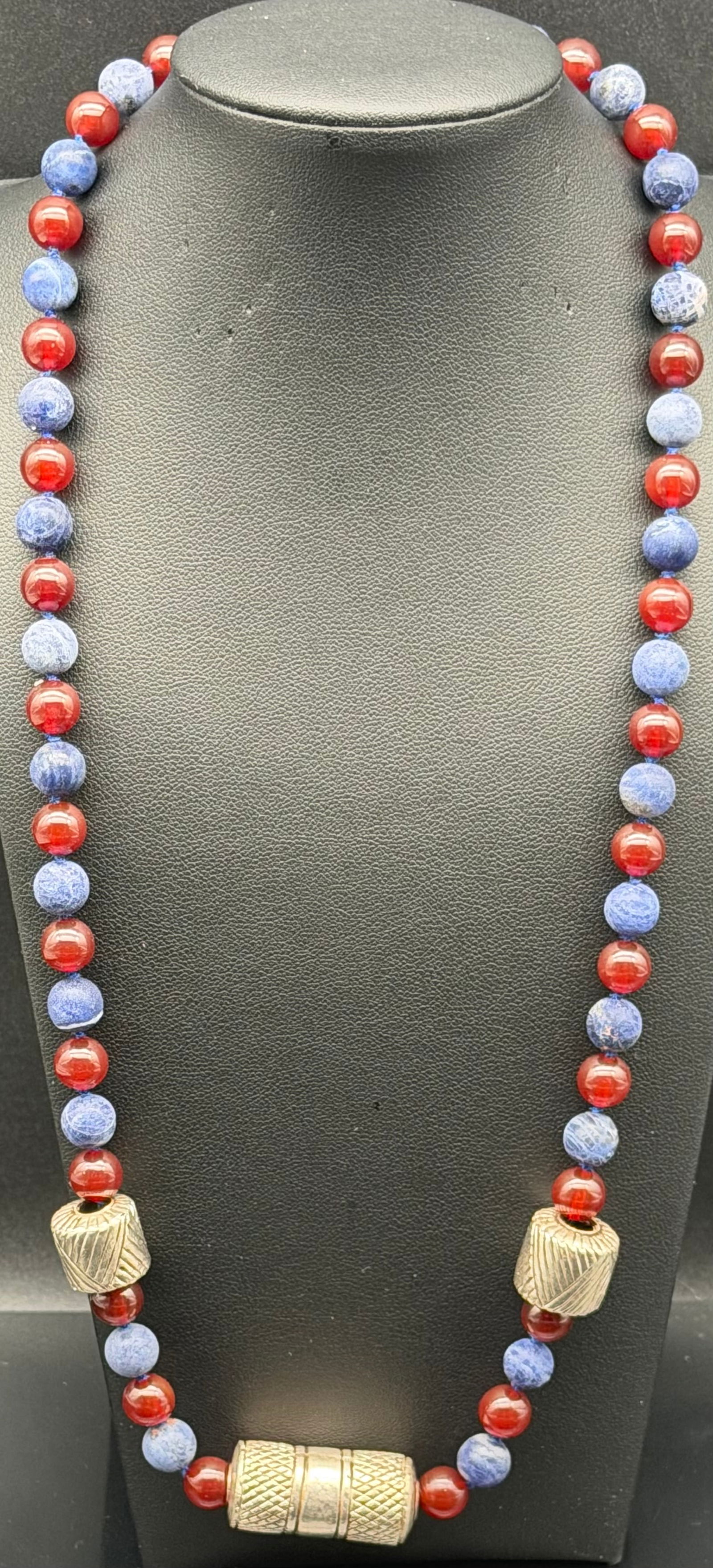 Vintage Red Blue Bead Necklace w Textured Barrel Clasp 50g: Vintage statement bead necklace featuring alternating red and blue round beads with decorative gold-tone barrel spacers and a large textured screw barrel clasp. Bold color contrast and chunky center e