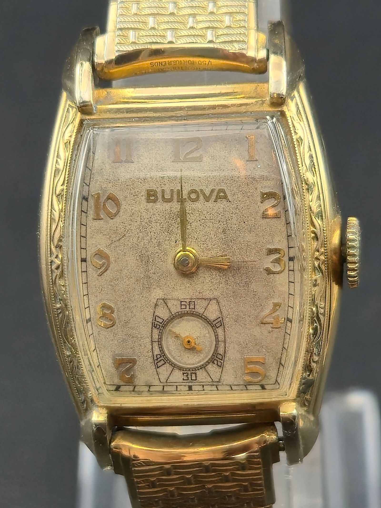 1947 Bulova 10BC Rectangular 10K RGP Watch 17J Small Seconds: Vintage Bulova rectangular wristwatch dating to 1947, powered by a Bulova 10BC manual-wind movement. The watch features a silver dial with applied Arabic numerals and a small seconds subdial at 6 o’