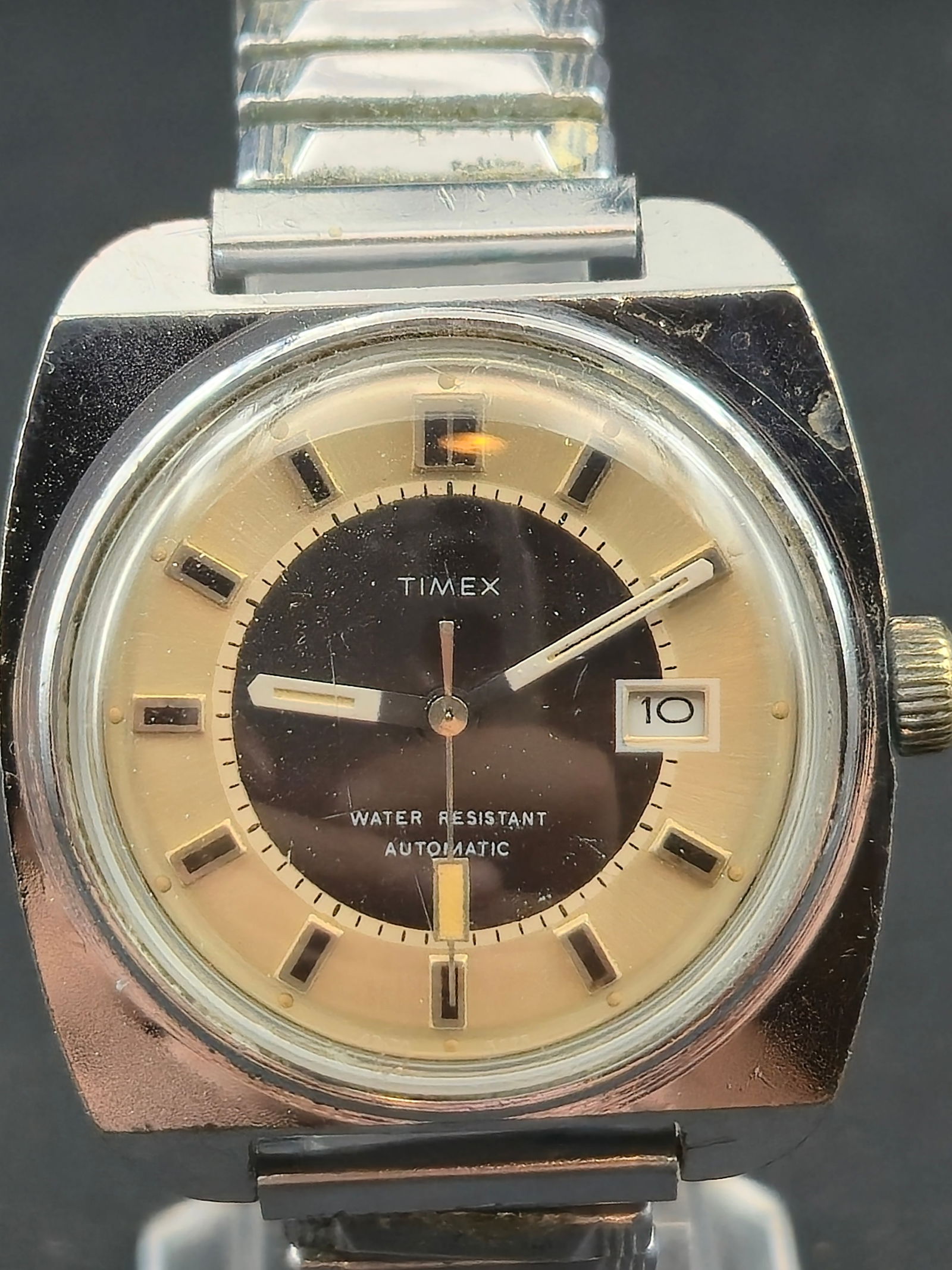1970s Timex Automatic Date Wristwatch 30.5mm Stainless Steel: Vintage Timex automatic wristwatch featuring a self-winding mechanical movement with date at 3 o’clock.Dial is a distinctive two-tone black and champagne design with applied rectangular hour markers
