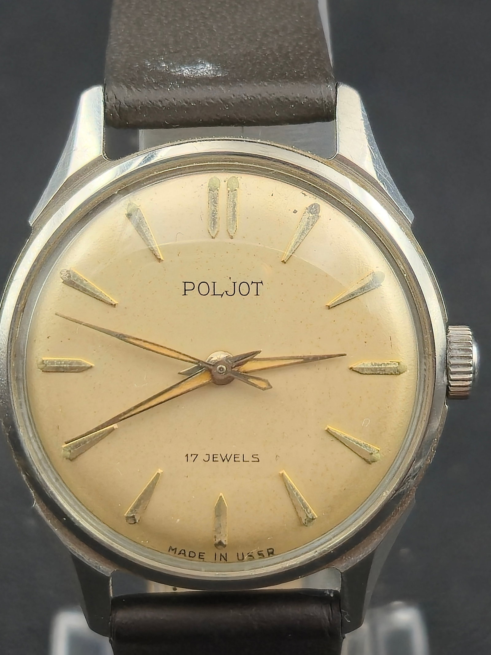 1960s Poljot 17J Mechanical Wristwatch Stainless Steel Case 32mm USSR: Vintage Poljot mechanical wristwatch with a clean cream dial and applied silver-tone indices. Dial is signed Poljot, 17 Jewels, with Made in USSR printed at the bottom. The watch is powered by a manua
