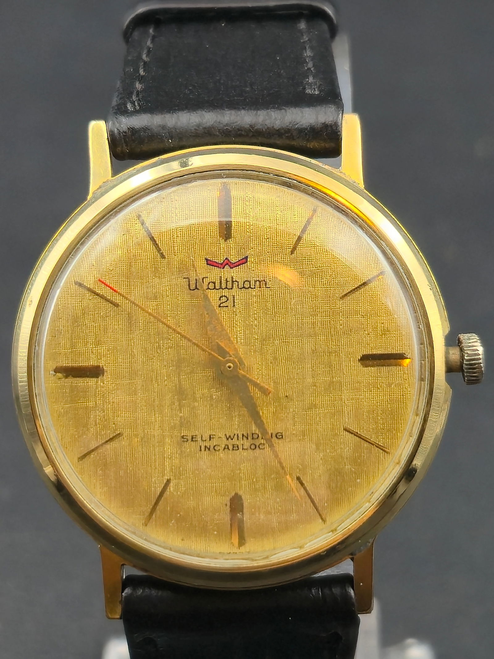 1960s Waltham 21J Automatic Gold Plated 33mm Swiss Watch: Vintage Waltham Swiss-made automatic wristwatch featuring a gold-tone textured dial with applied baton hour markers. Dial is signed Waltham 21 with Self-Winding Incabloc. Automatic movement is marked