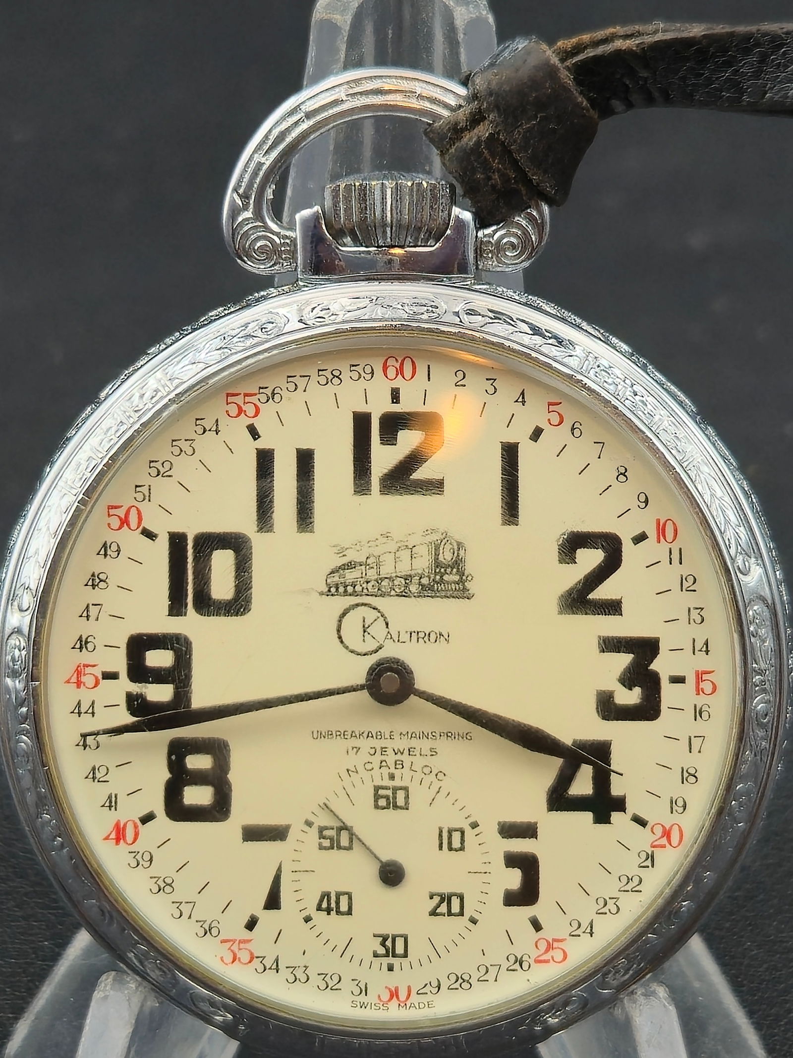 Alstater Watch Co 17J Swiss 49mm Montgomery Dial Engraved Case Runs: Alstater Watch Co Swiss pocket watch with Montgomery style dial. Movement marked Alstater Watch Co, Swiss, Seventeen, Unadjusted.White Montgomery dial with outer red 5–60 minute track and inner 1–