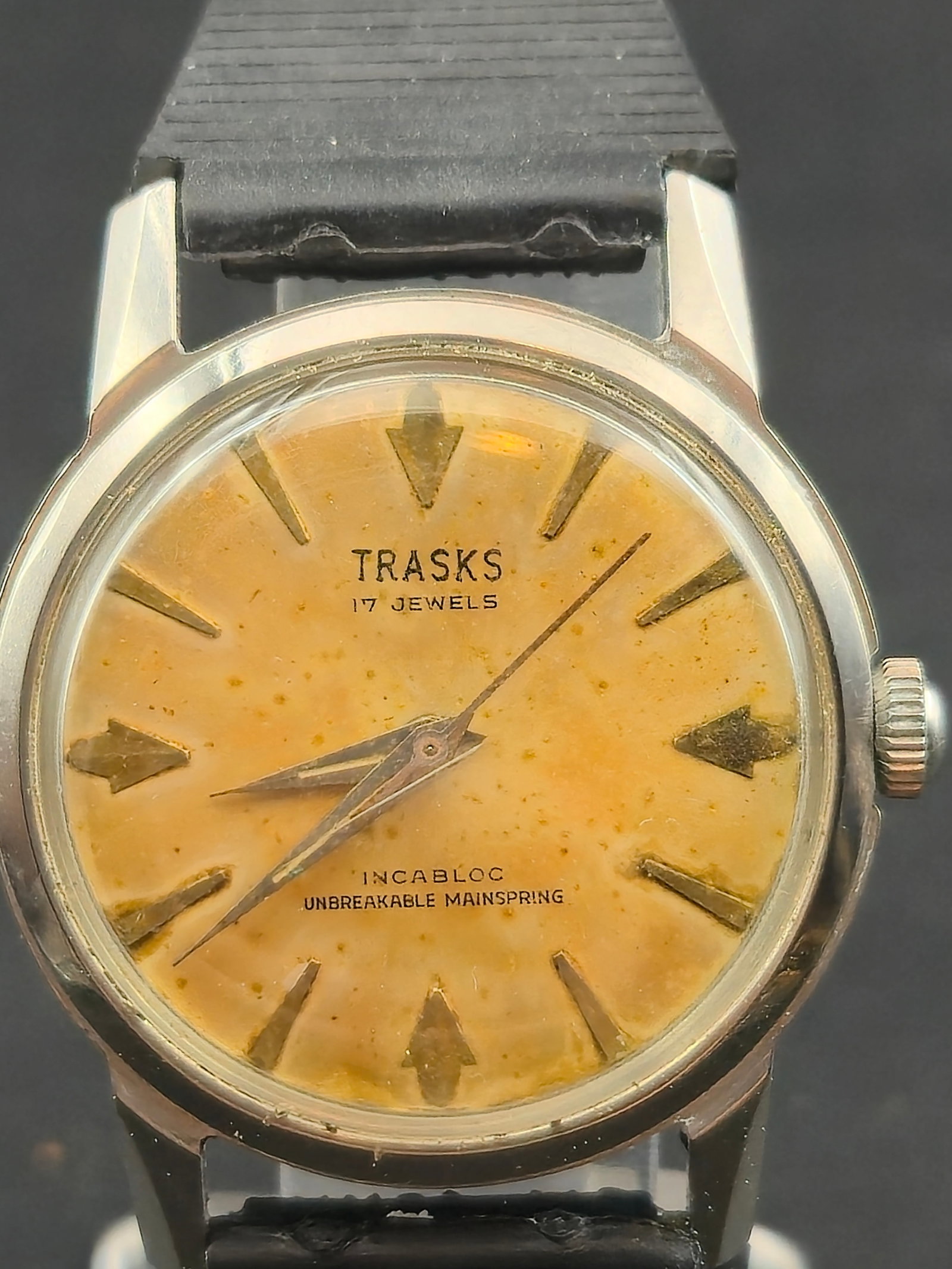 Trasks 17J Incabloc Stainless Steel 32mm Manual Wind 1960s Running: Vintage Trasks 17 jewels manual wind wristwatch featuring Incabloc shock protection and unbreakable mainspring. Stainless steel case marked waterproof tested 7217. Silver tone case with aged tropical 