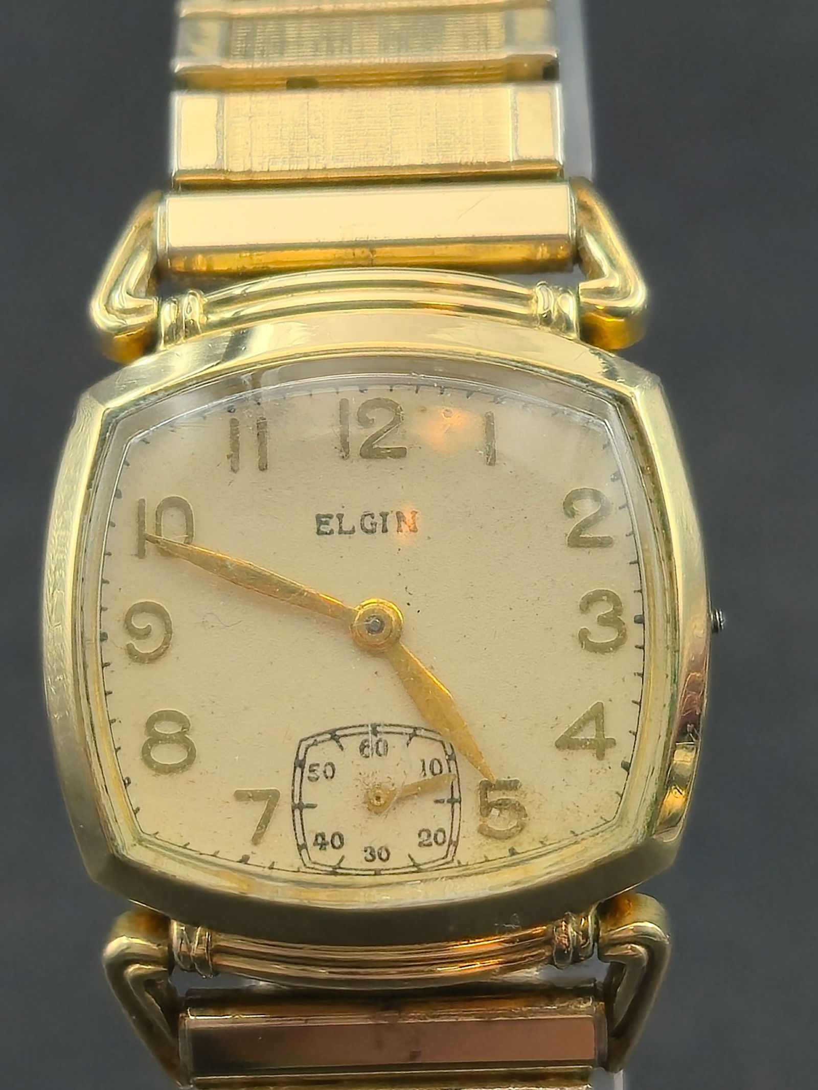 1947 Elgin 15J 10K Gold Filled Cushion Case 25mm Manual Wind Star Case Starts Stops: Vintage Elgin manual wind wristwatch with cushion case and small seconds at 6. Dial signed Elgin with Arabic numerals and sub-seconds register.Movement signed Elgin U.S.A., 15 Jewels, serial number 37