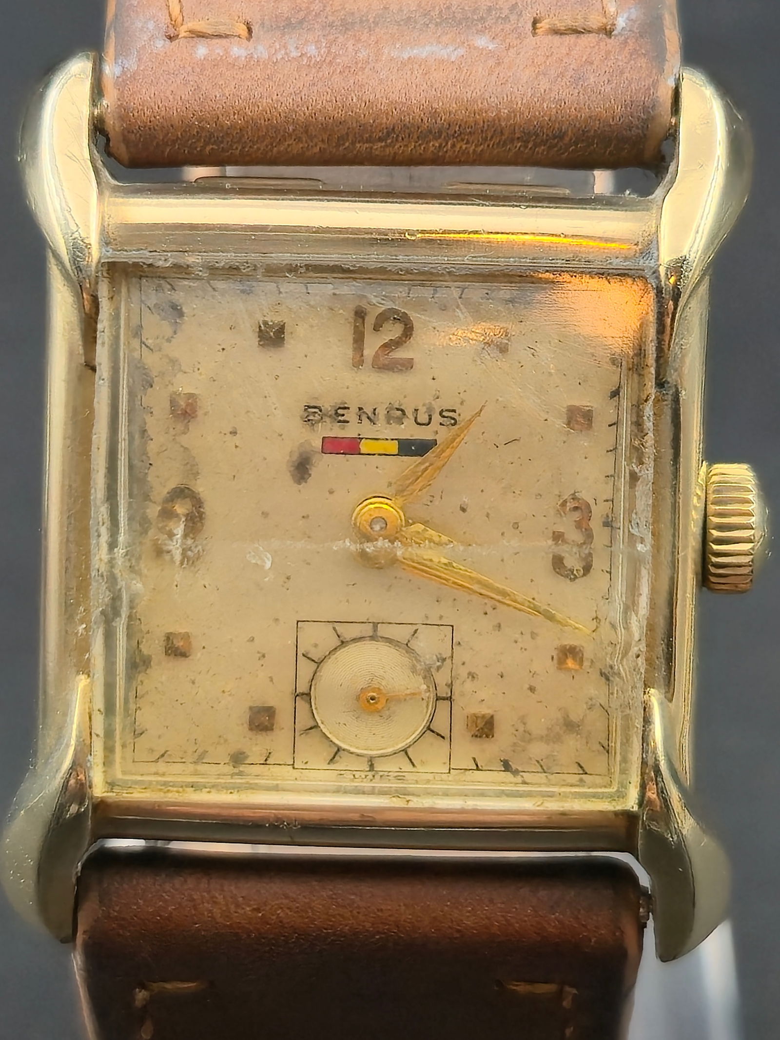 1946 Benrus BA2 17J 26mm 10K Gold Filled Subseconds Starts and Stops: 1946 Benrus rectangular wristwatch featuring 10K gold filled case and cream dial with applied hour markers and subseconds at 6. Dial signed Benrus.Manual wind Swiss movement marked Benrus Watch Co Inc