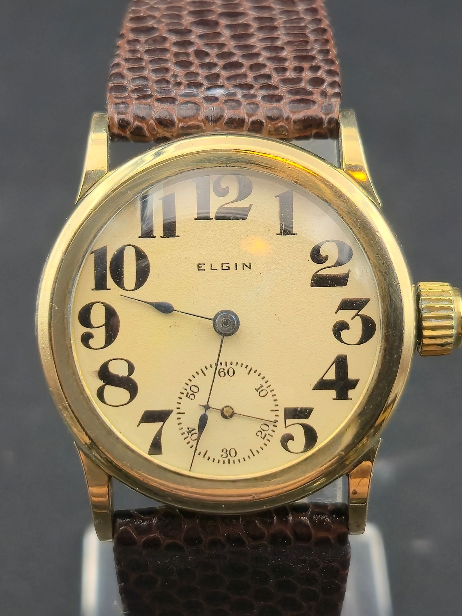 1911 Elgin Grade 320 7J 10K Rolled Gold Plate 30mm Sub Seconds Running: Vintage 1911 Elgin wristwatch powered by Elgin Grade 320 Model 2 manual wind movement, serial 15266278. 0 size movement with 7 jewels, 3/4 plate, pendant set. Case marked 10K Rolled Gold Plate. Cream