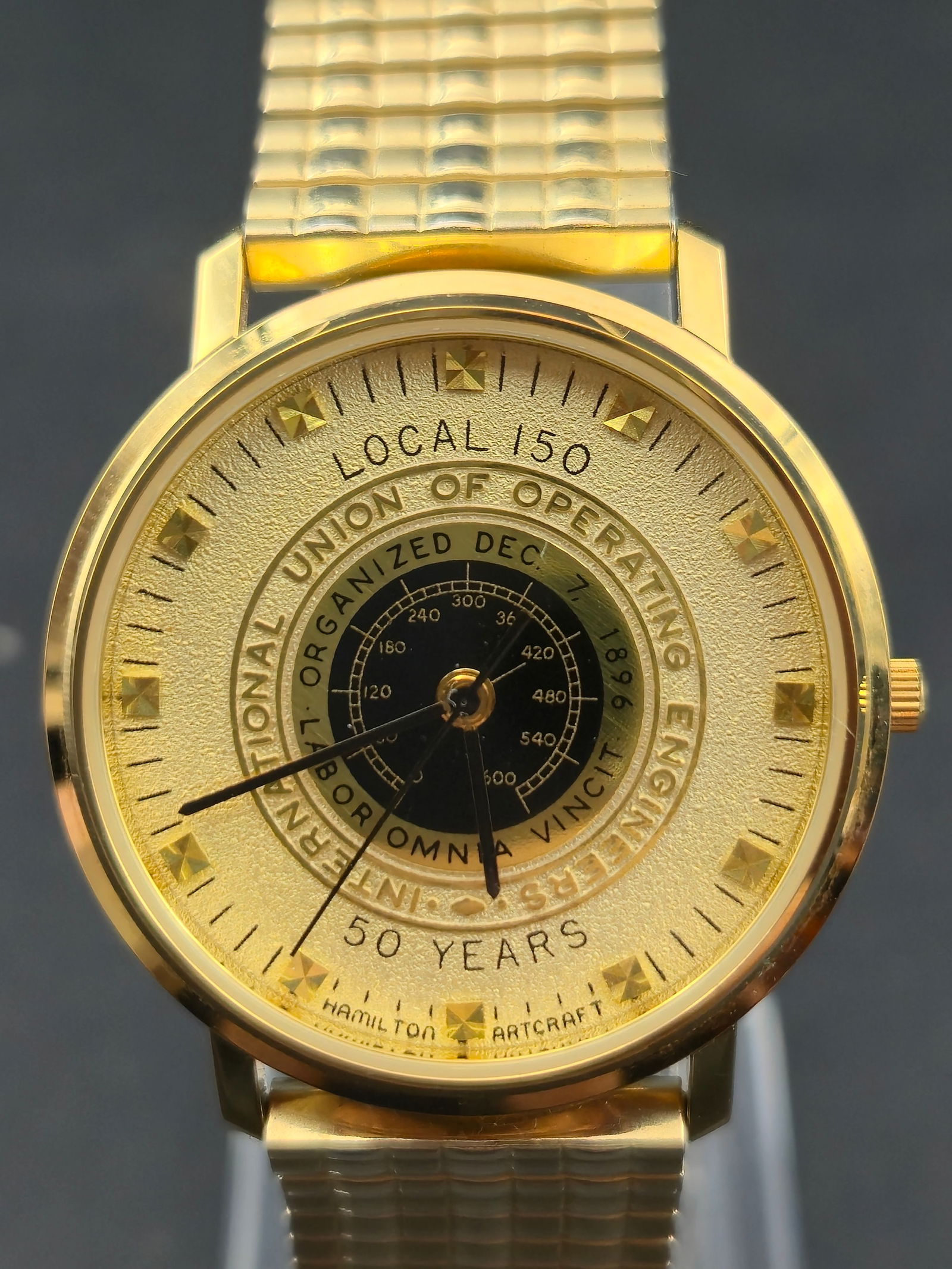 2000 Hamilton Masterpiece Local 150 50 Years 33mm Quartz Gold Tone Full Set: Hamilton Masterpiece Local 150 commemorative wristwatch celebrating 50 Years. Dial marked Local 150, International Union of Operating Engineers, 50 Years, and Hamilton American Artcraft. Caseback engr