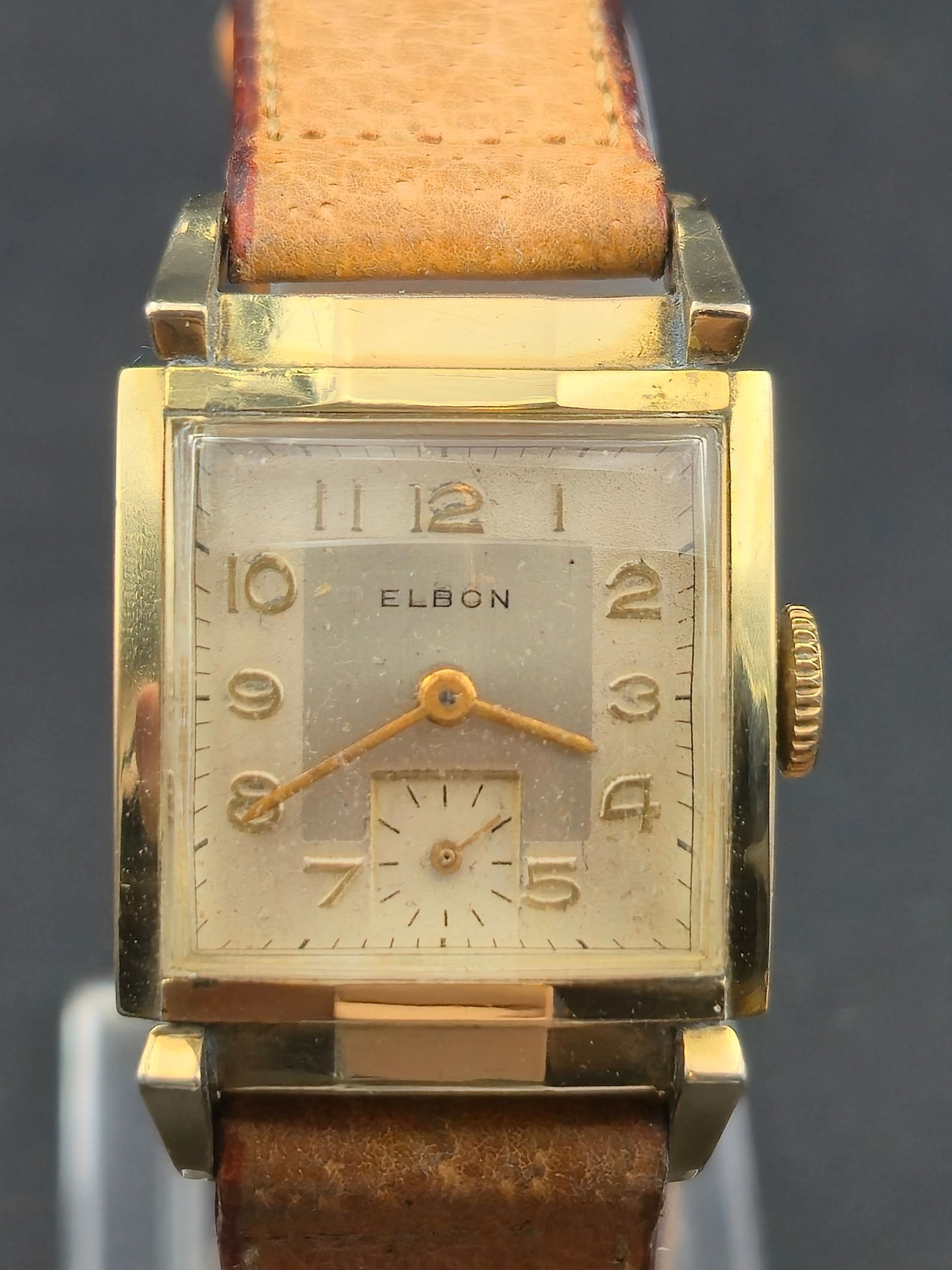 Vintage Elbon 1072 17J Swiss Manual Wind 23mm 10K RGP Bezel Rectangular Sub Seconds Running: Vintage Elbon rectangular dress watch.Cream dial signed ELBON with Arabic numerals and sub-seconds at 6. Gold tone hands and applied numerals. Acrylic crystal.Manual wind Swiss movement marked:Elbon W
