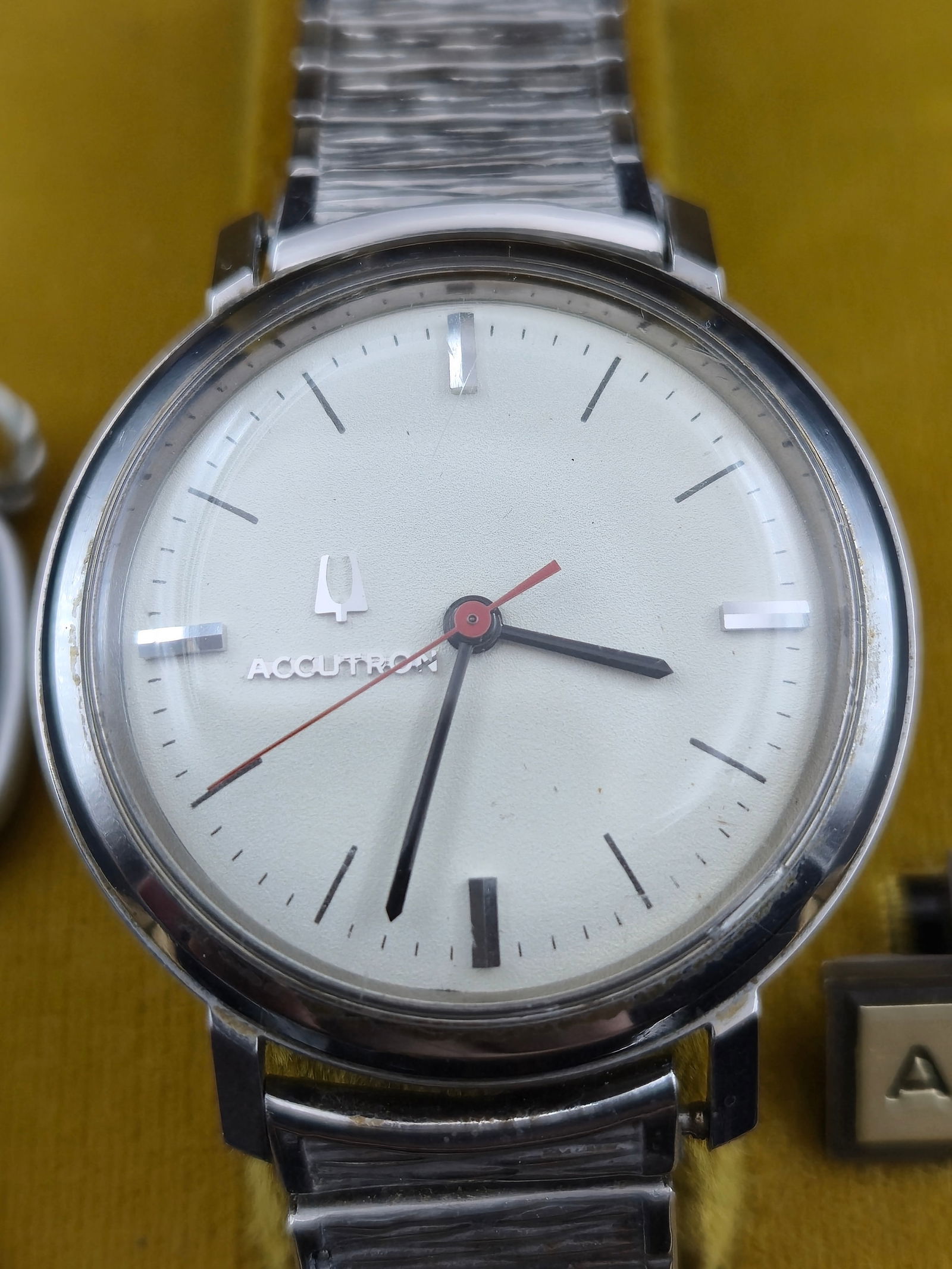 1971 Bulova Accutron Cal 214 Tuning Fork 35mm Stainless Steel N1 w Box Bracelet Running Fresh Batter: 1971 Bulova Accutron tuning fork wristwatch powered by the Caliber 214 U.S.A. movement.Original white dial with applied markers, red seconds hand, and Accutron logo. Stainless steel case measuring app