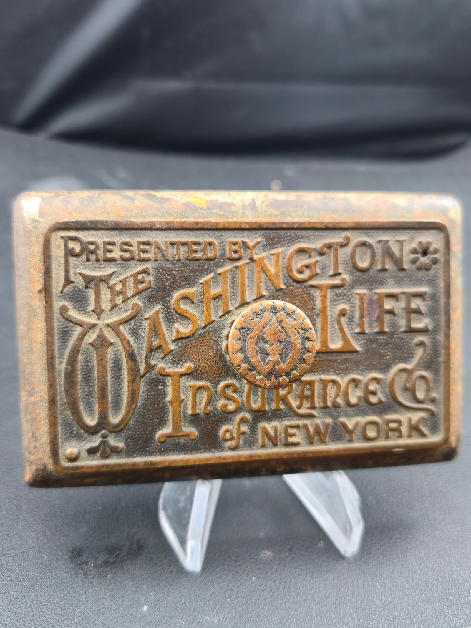 Antique Washington Life Insurance NY Solid Brass Advertising Desk Piece Wm Becker Boston: Antique solid brass advertising desk piece presented by The Washington Life Insurance Company of New York. Raised lettering with decorative Victorian reverse panel. Back marked Wm. Becker Boston.Late 