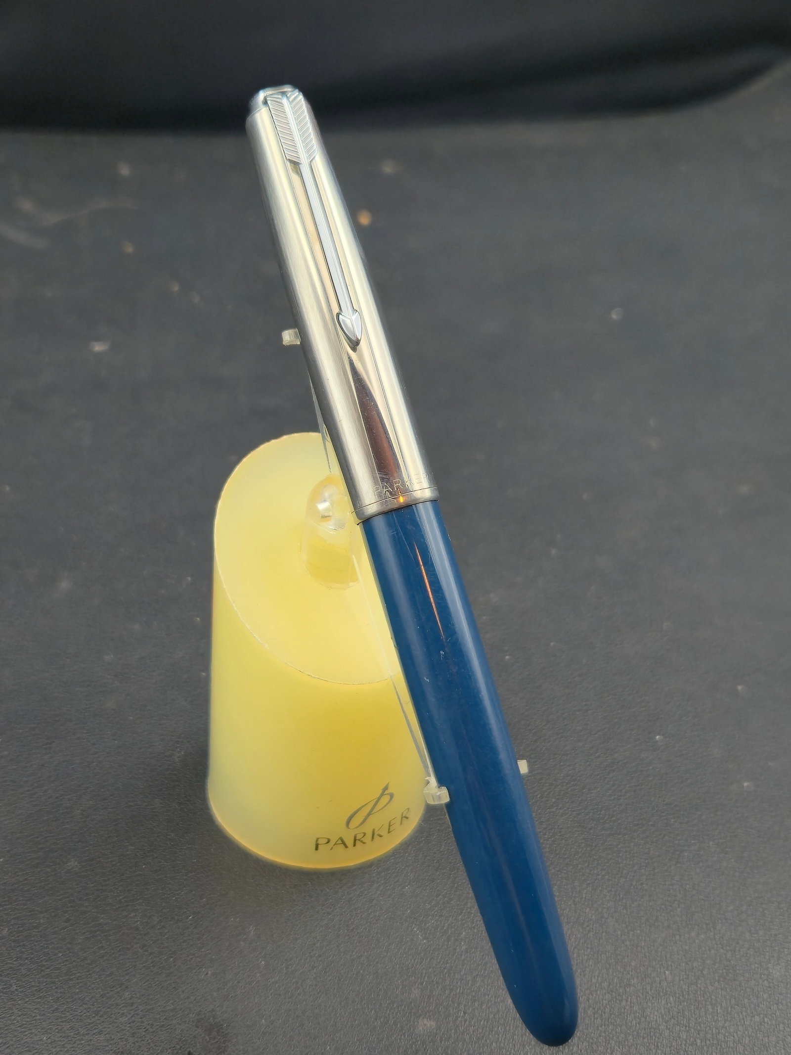 Vintage Parker 51 Fountain Pen Blue Lustraloy Cap Made in USA: Vintage Parker 51 fountain pen with blue barrel and brushed stainless steel Lustraloy cap. Barrel imprint reads Parker 51. Cap stamped Made in USA. Classic hooded nib design with Parker arrow clip.Sur