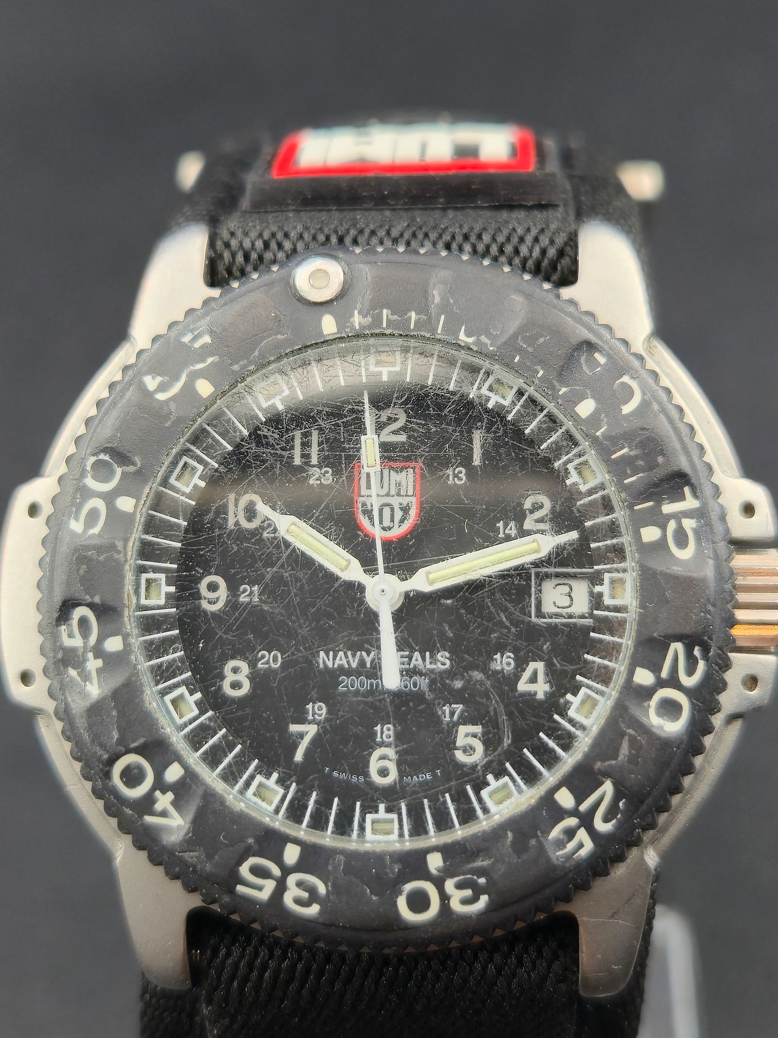 1990s Luminox Navy SEAL 200m 45mm Swiss Quartz Dive Watch Date Black Dial Running New Battery: 1990s Luminox Navy SEAL Swiss quartz dive watch with black dial, date at 3, inner 24-hour scale, and unidirectional rotating bezel. Dial marked Navy SEAL 200m 660ft and Swiss Made T. Caseback marked L