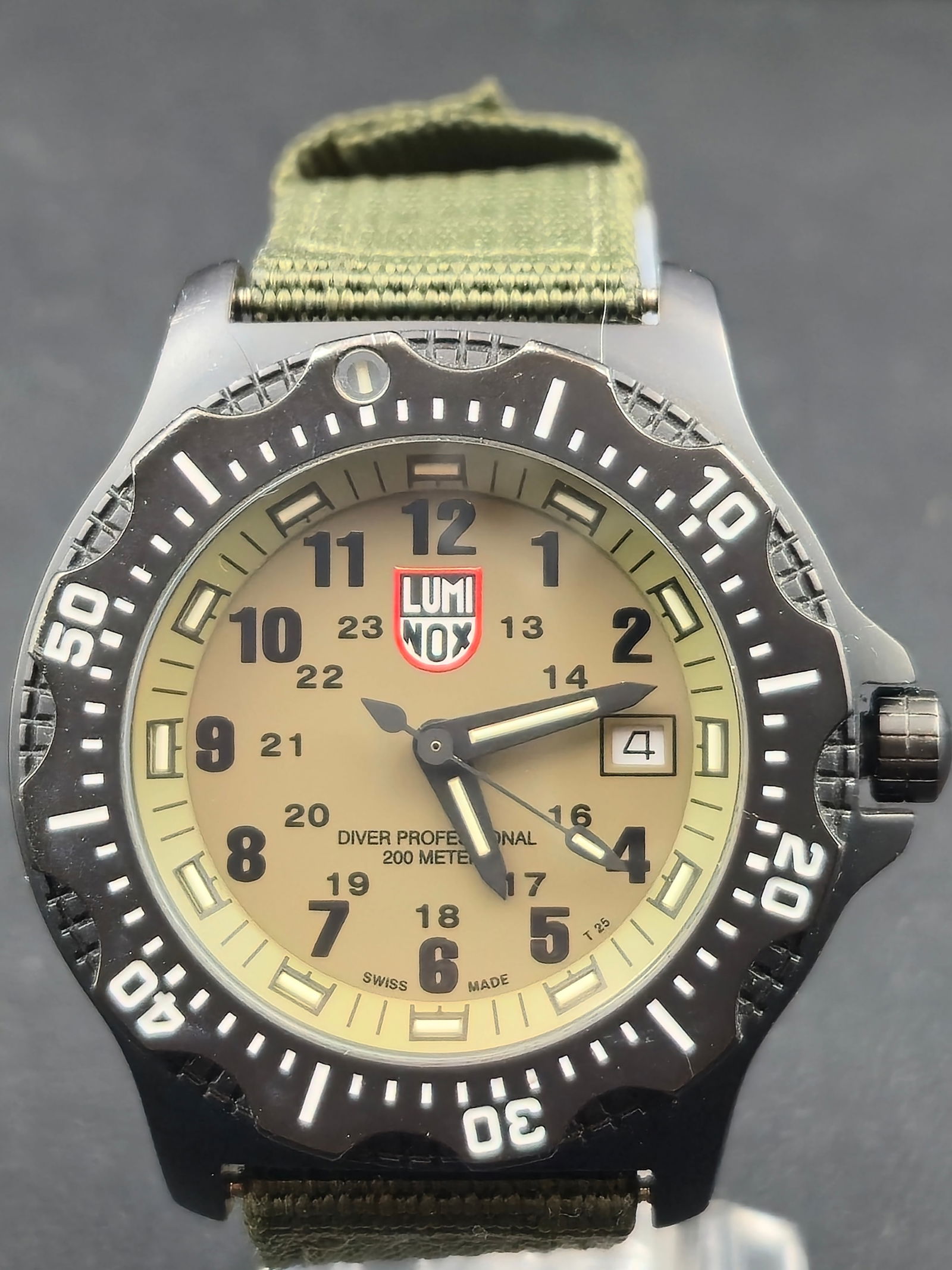 1990s Luminox Navy SEAL Series 8400 44mm Swiss Quartz 200m Dive Watch Running New Battery: 1990s Luminox Navy SEAL Series 8400 Swiss quartz dive watch with green tritium dial, date at 3, inner 24-hour scale, and unidirectional rotating bezel. Dial marked Diver Professional 200 Meters, Swiss