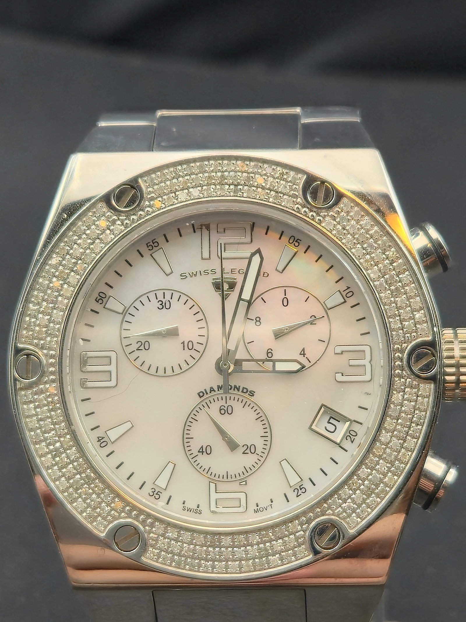 Swiss Legend Diamonds Chronograph 46mm 316L Steel MOP Dial 10ATM Sapphire Watch New Battery: Swiss Legend Diamonds chronograph with mother of pearl dial, three subdials, angled date display, and diamond-set bezel. Dial marked Swiss Legend and Diamonds. Luminous hands and applied numeral marke