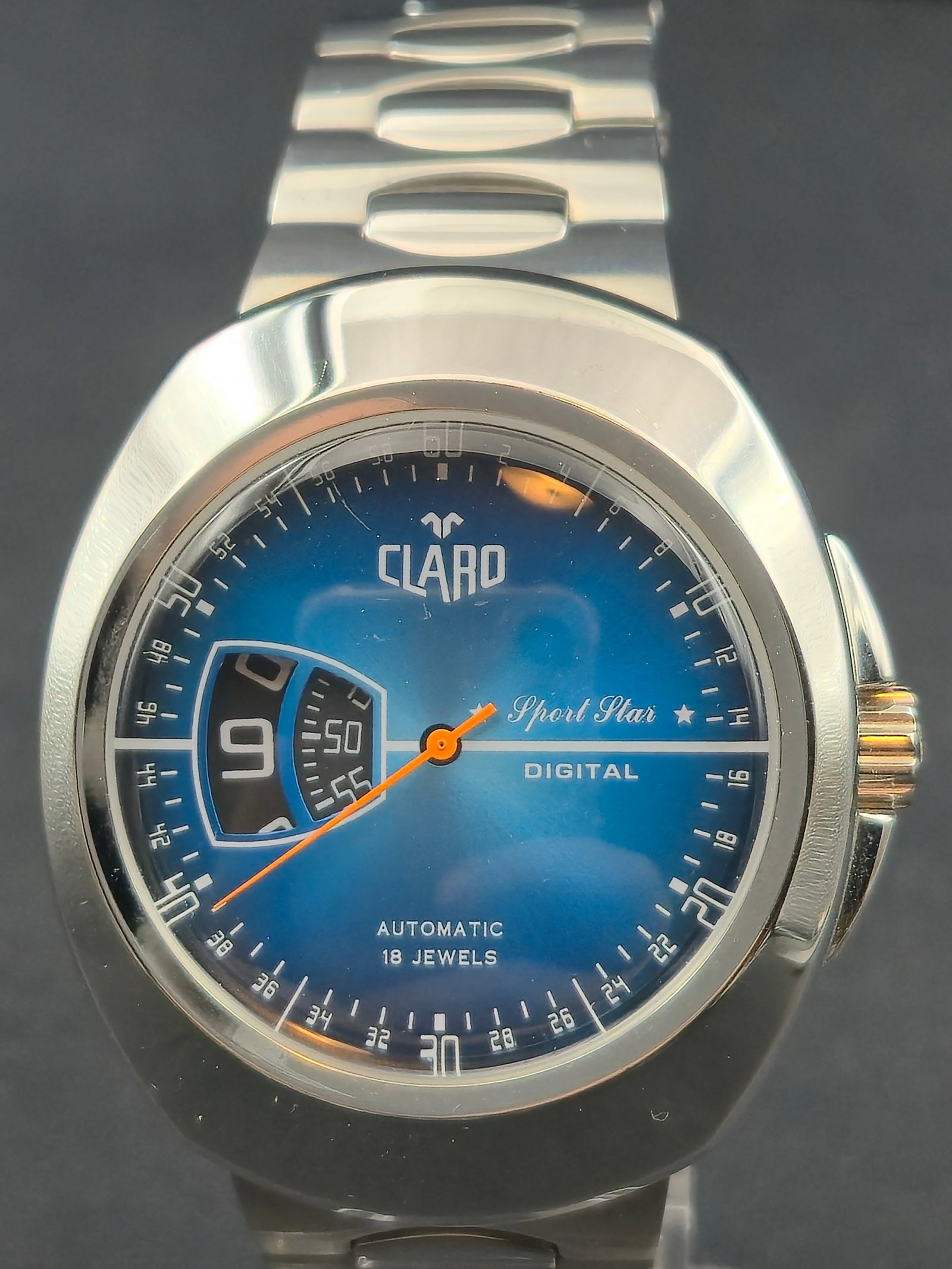 Claro Sport Star Automatic 18 Jewels Digital Jump Hour 44mm Watch Mint: Claro Sport Star automatic wristwatch featuring blue gradient dial with digital jump hour window at left and central orange seconds hand. Dial marked Claro, Sport Star, Digital, Automatic 18 Jewels.Ex