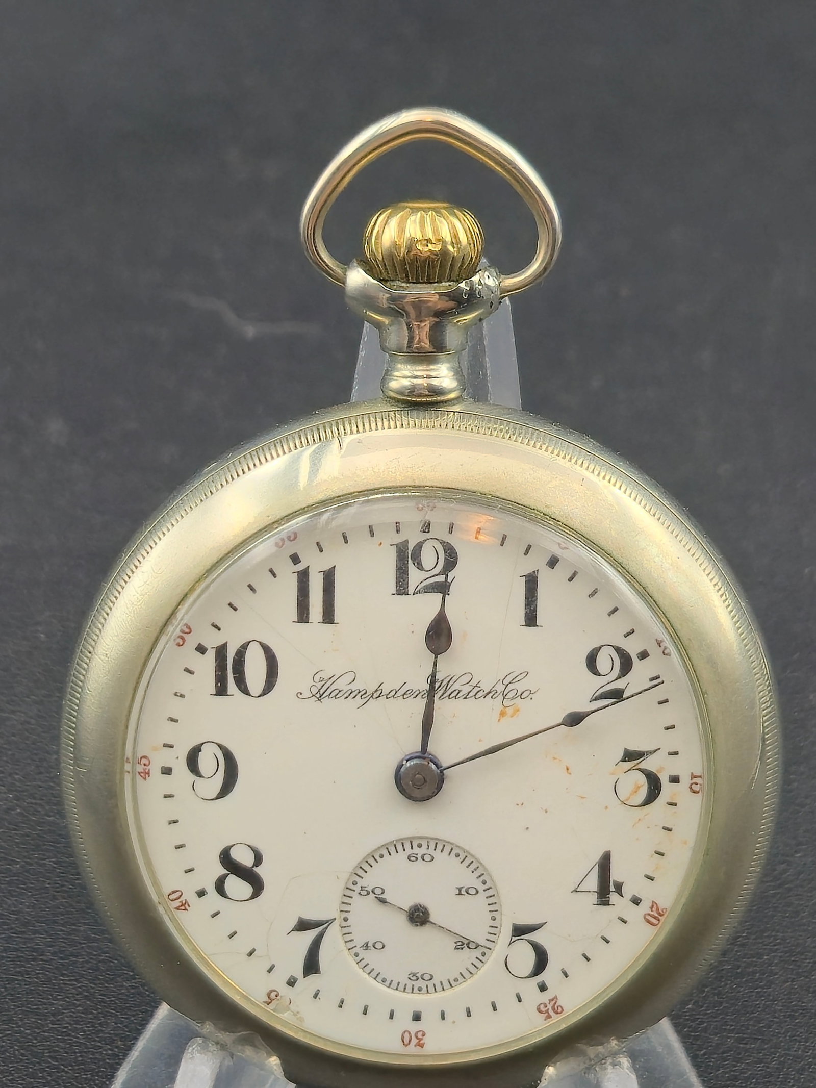 1911 Hampden No 64 Model 3 18s 17j Dueber Silverine Case Running: 1911 Hampden Grade No 64 Model 3 pocket watch, 18 size, 17 jewels, pendant set, full plate nickel movement with geometric radial finish. Movement serial 2866135. Marked Hampden Watch Co Canton Ohio 17