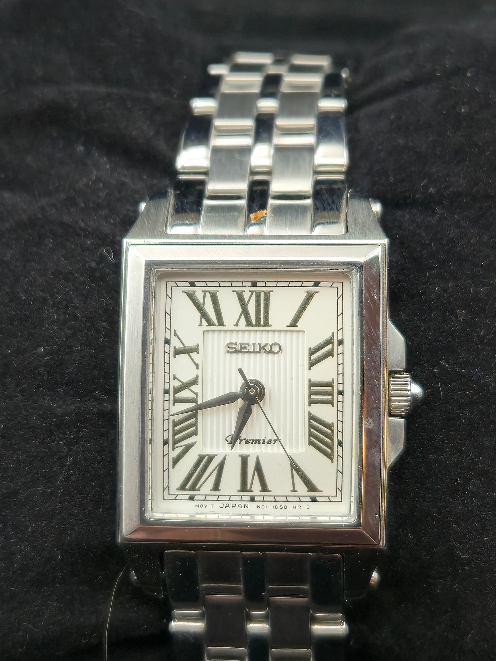 NOS Seiko Premier SXGP11 10 Bar Stainless Sapphire Quartz Roman Dial Full Set Box: New old stock Seiko Premier reference SXGP11 stainless steel rectangular quartz wristwatch with Roman numeral dial, sapphire crystal, and 10 bar water resistance. This example retains original Seiko b